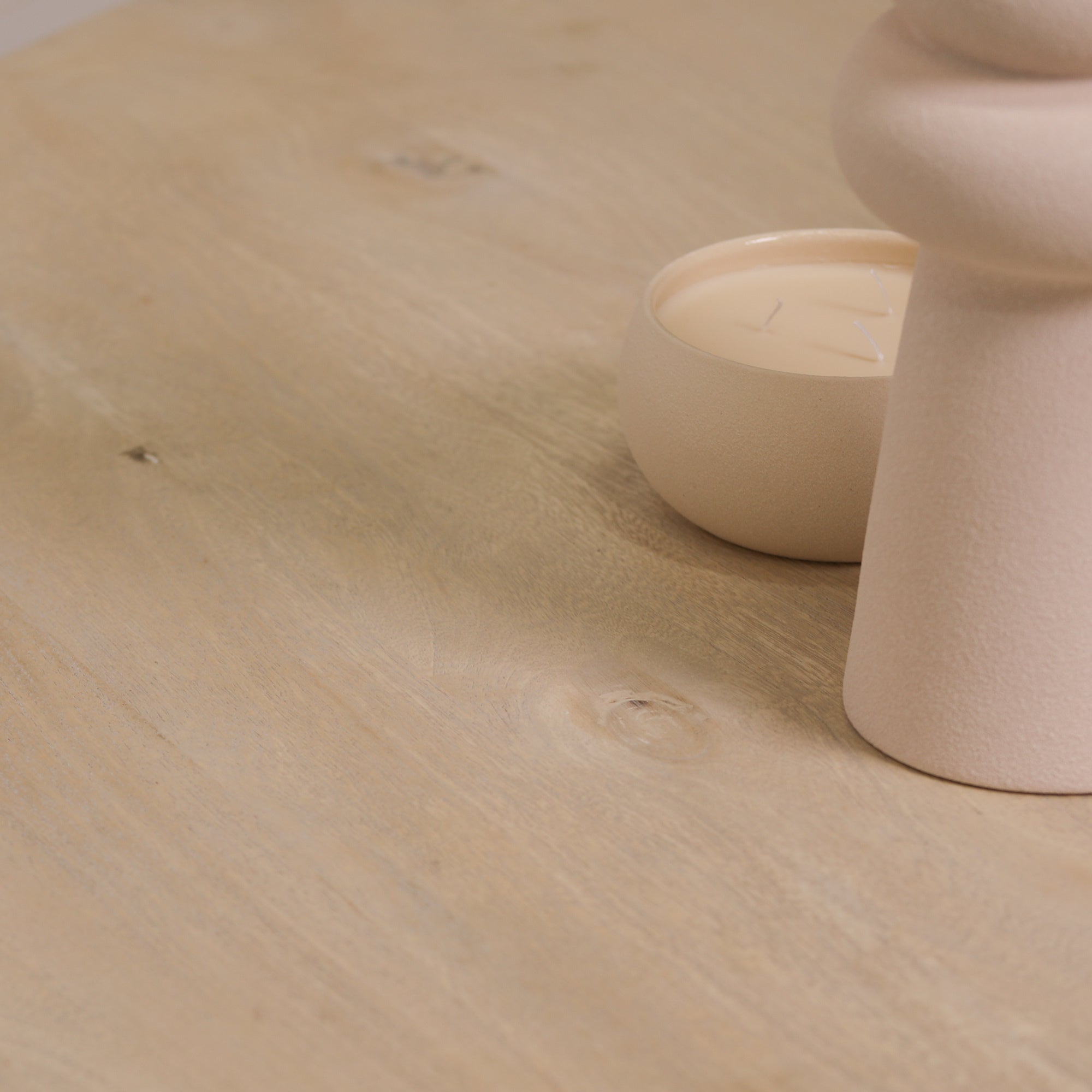 Detailed close-up of the Camille Round Pedestal Dining Table tabletop displaying the authentic Bleached Mango Wood grain, natural knots, smooth handcrafted finish and premium solid wood surface for everyday dining and entertaining.