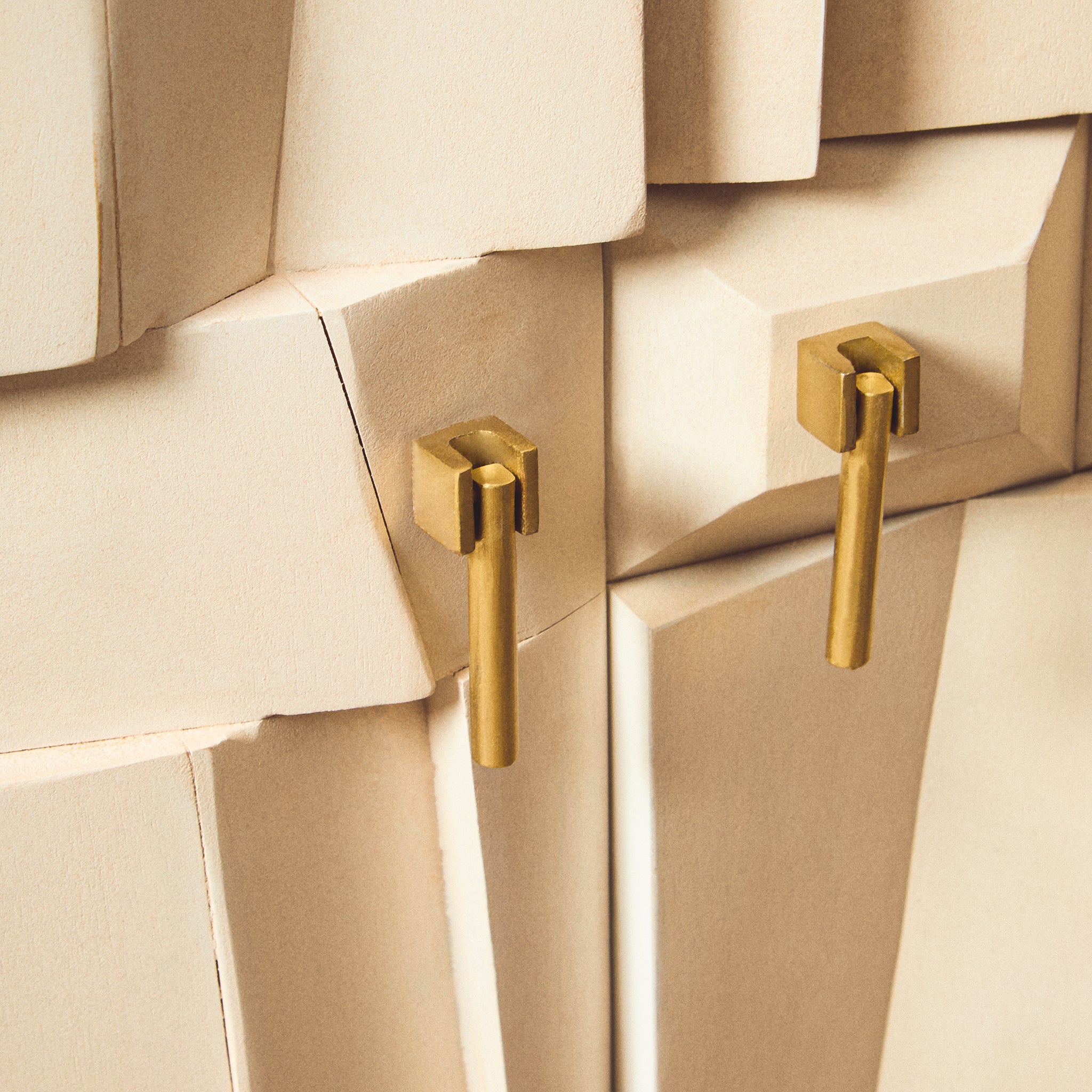 Close-up of the Camille Sideboard brass cabinet handles with handcrafted geometric whitewashed mango wood door detailing and premium furniture finish.