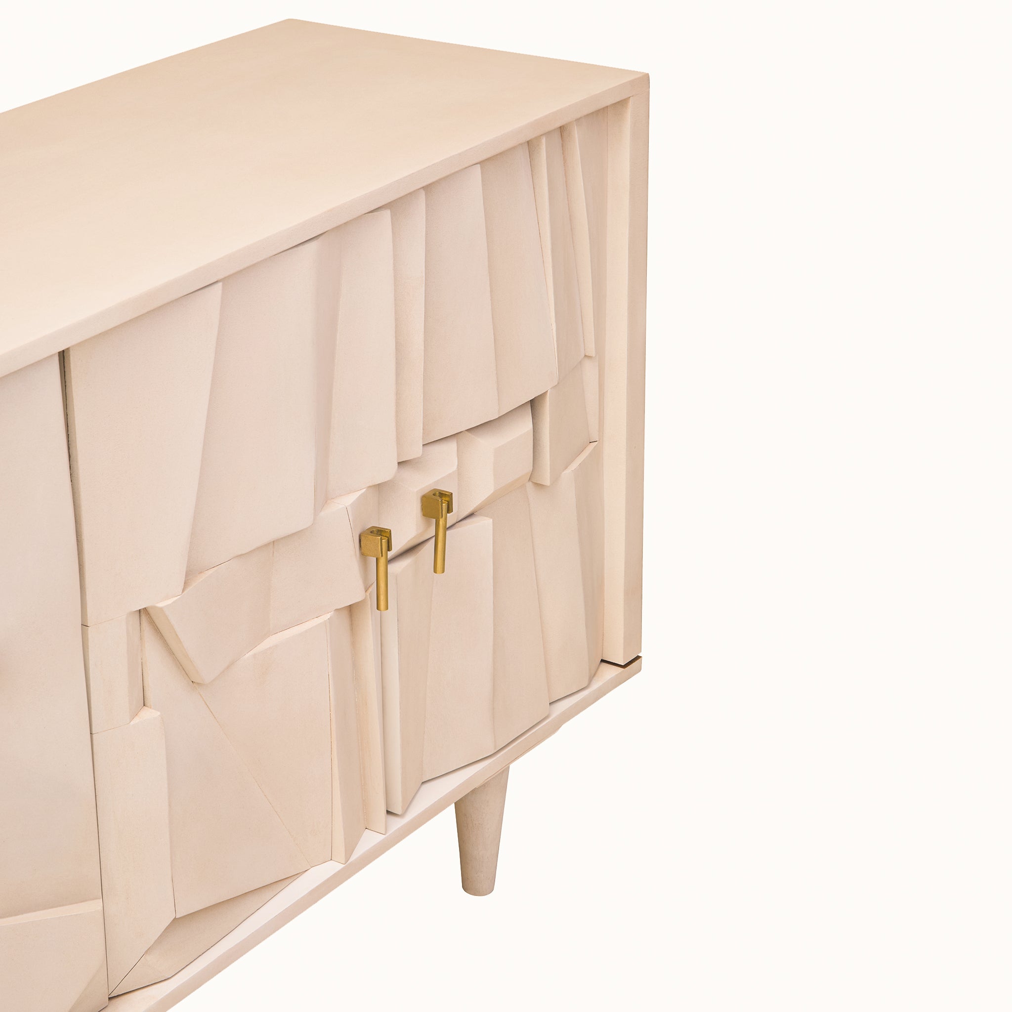 Corner detail of the Camille Whitewashed Mango Wood Sideboard featuring handcrafted geometric panels, brushed brass handles and premium contemporary design.