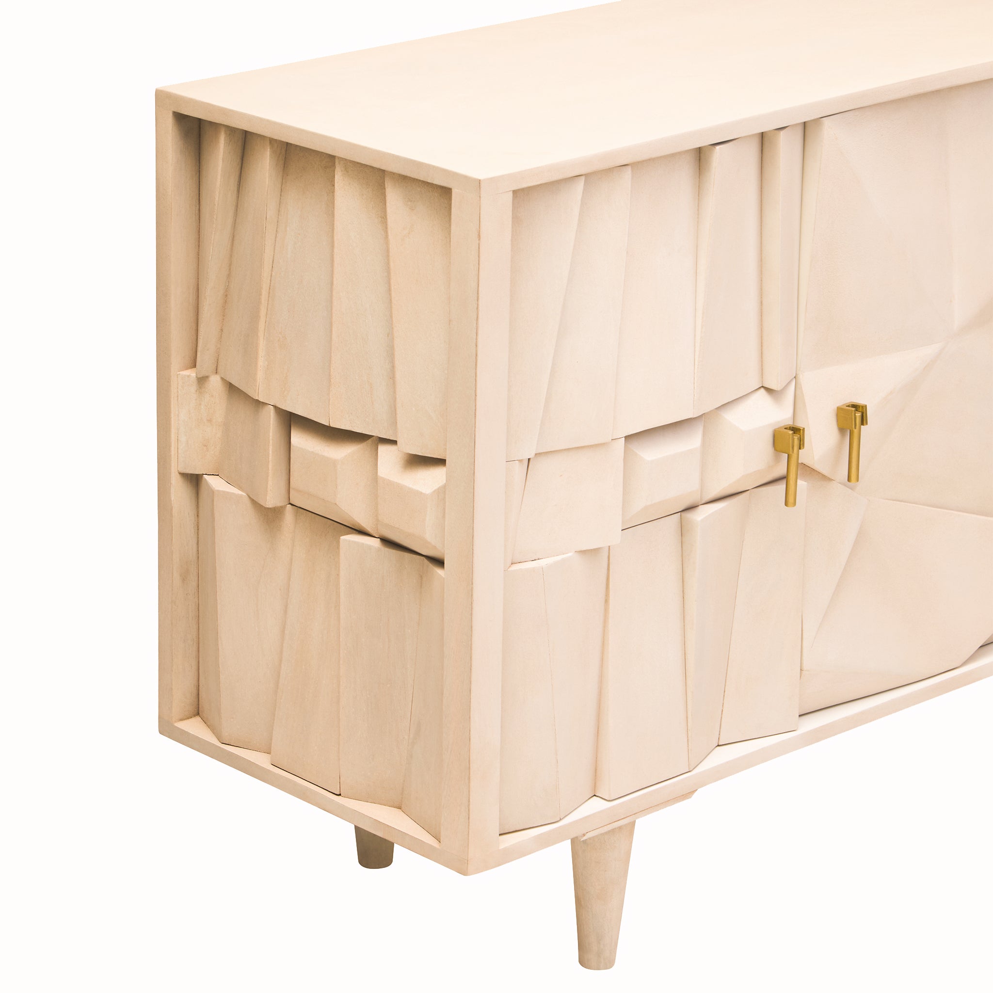 Corner view of the Camille Sideboard – Four Door Mango Wood, Whitewashed Finish showing sculptural geometric panels, textured wood grain and brass cabinet handles.