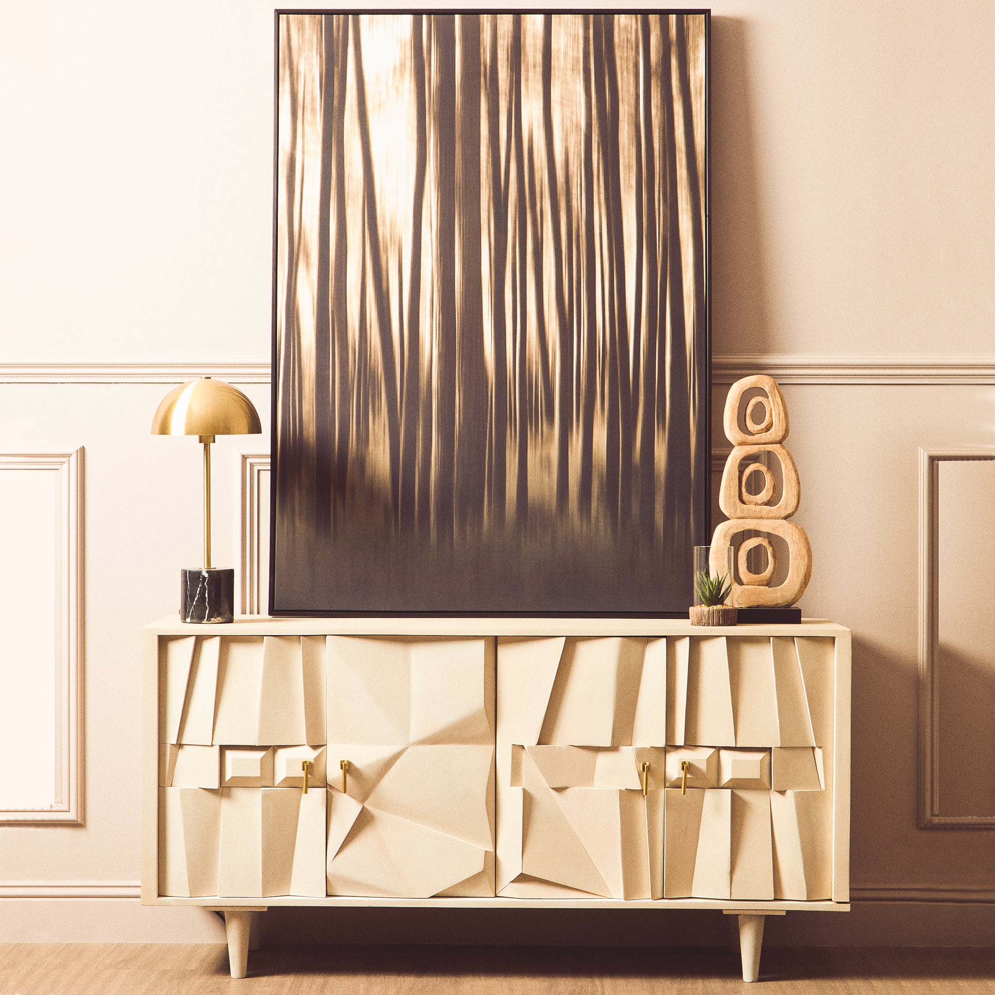 Camille Sideboard – Four Door Mango Wood, Whitewashed Finish styled in a contemporary living room with abstract artwork, decorative accessories and brass table lamp, modern luxury storage cabinet.