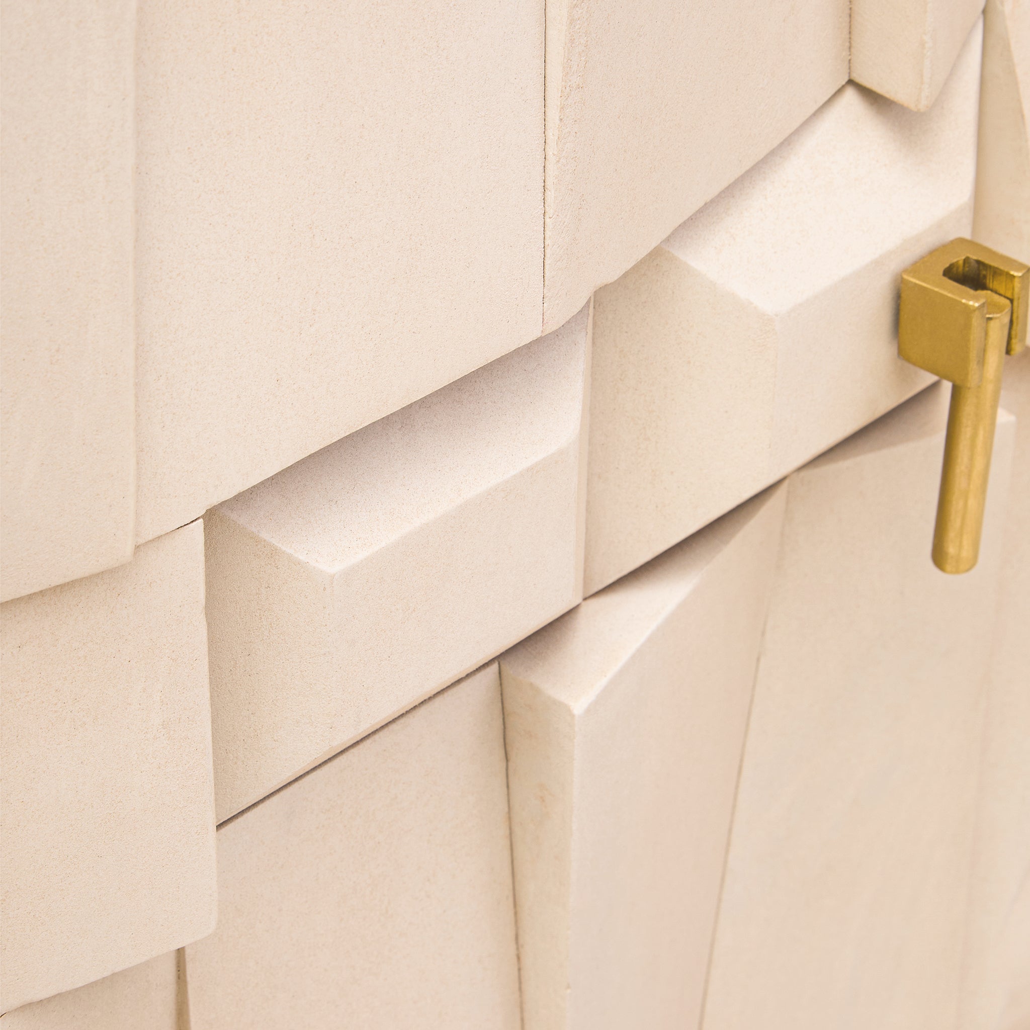 Detailed geometric panel design on the Camille Sideboard – Four Door Mango Wood, Whitewashed Finish featuring handcrafted sculptural woodwork and brass handle.