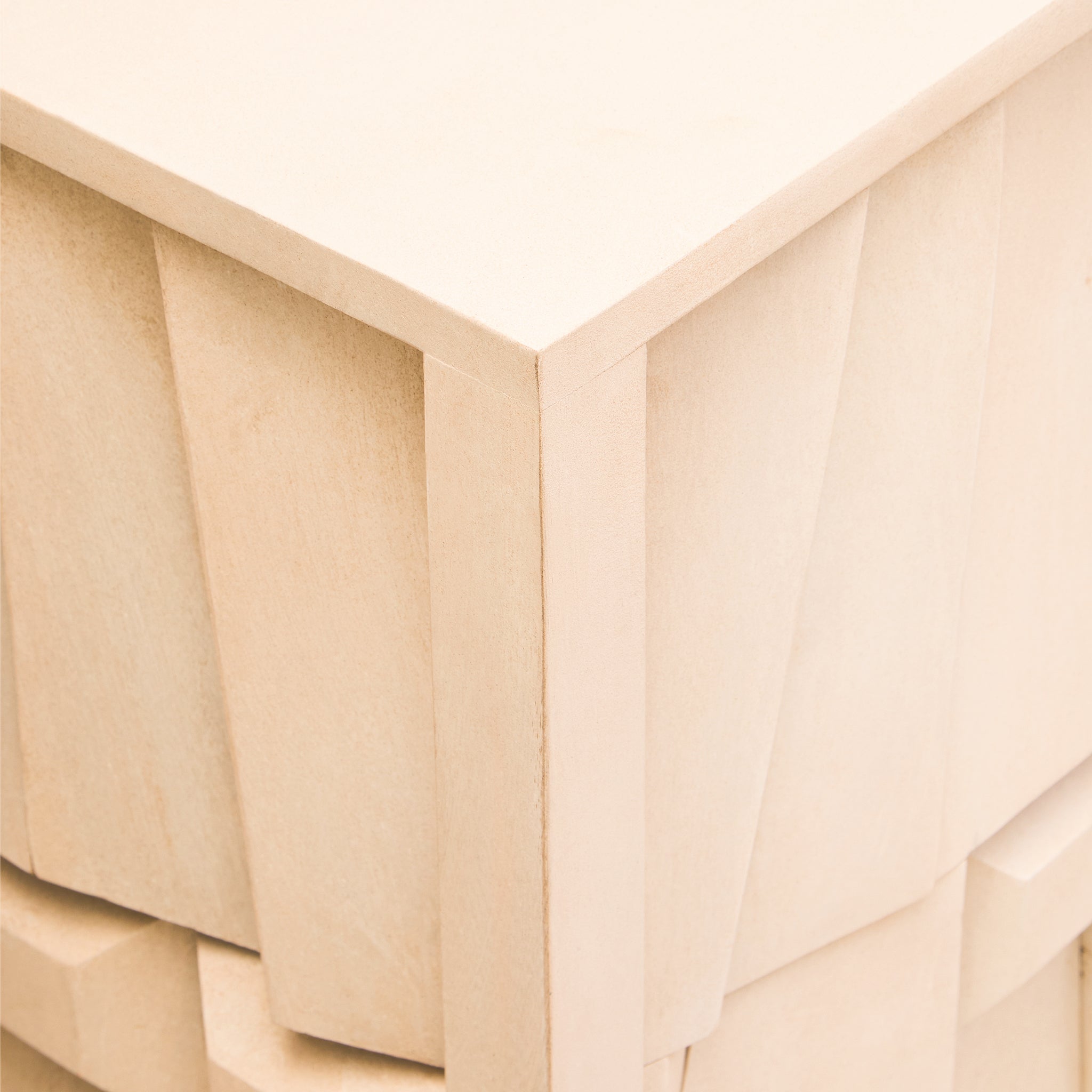 Close-up of the handcrafted whitewashed mango wood finish on the Camille Sideboard highlighting the sculptural geometric texture and premium craftsmanship.