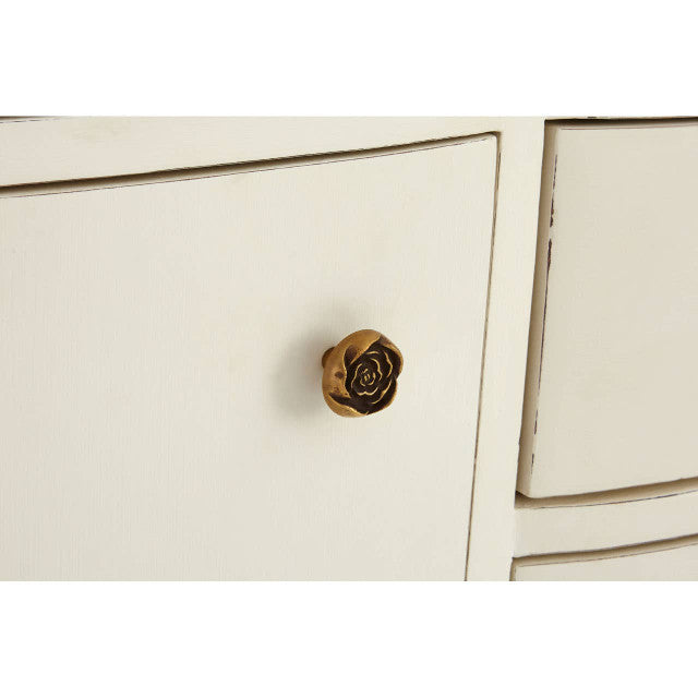 Close-up of the Camille White Baroque Six Drawer Sideboard featuring the decorative antique brass cupboard knob, white painted cabinet door and handcrafted Baroque-inspired detailing.
