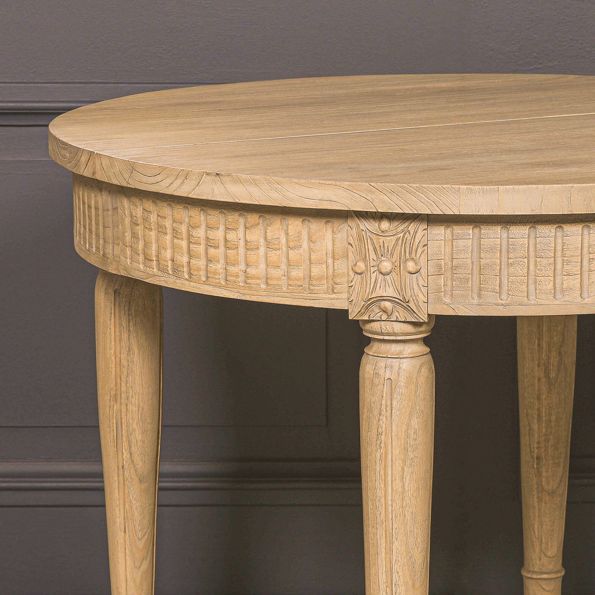Detailed close-up of the carved corner joint and decorative apron on the Camille White Cedar Wood Extendable Dining Table, showcasing the natural white cedar wood grain, handcrafted detailing and rustic finish.