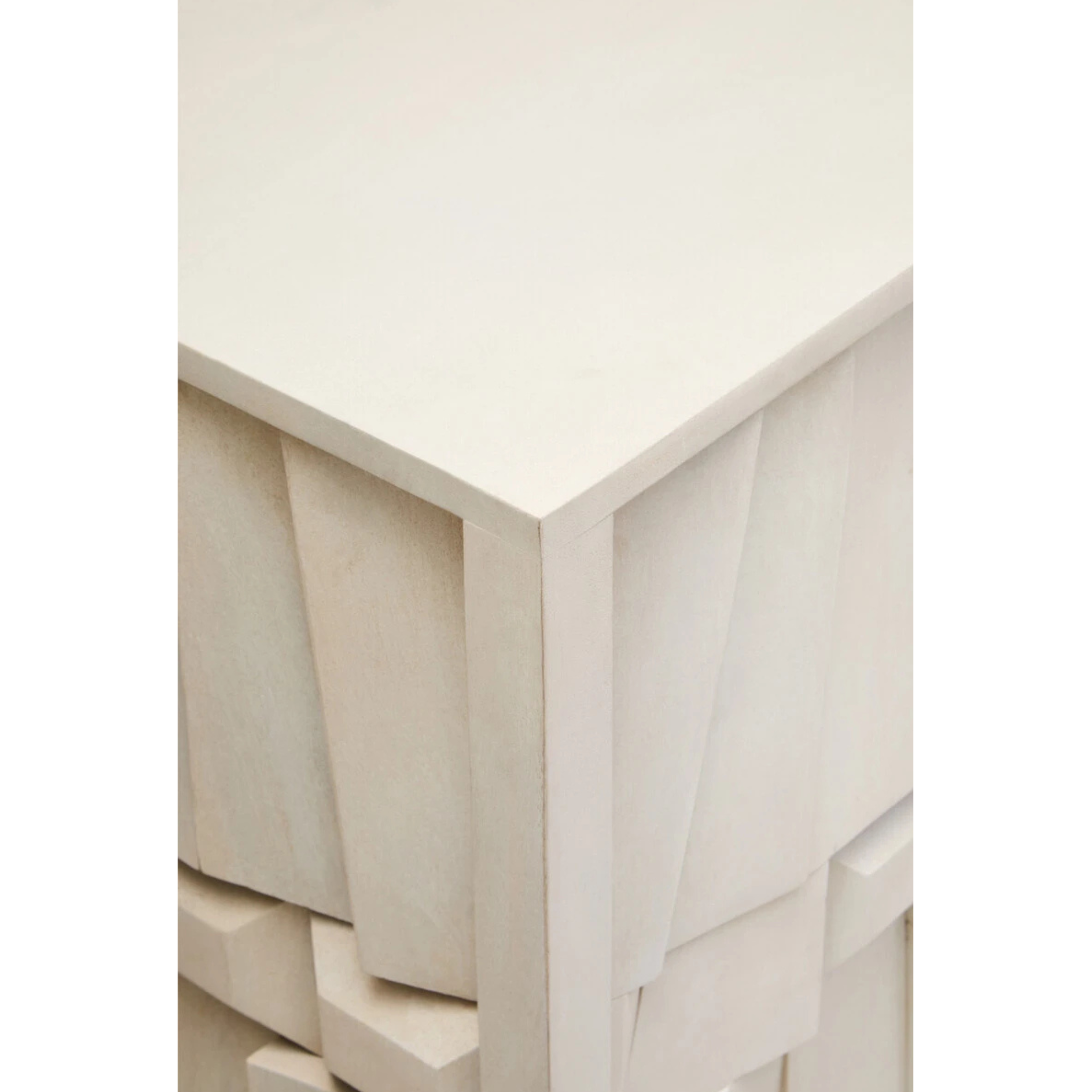 Close-up of Camille whitewashed mango wood sideboard corner and sculptural panel detailing on a white background