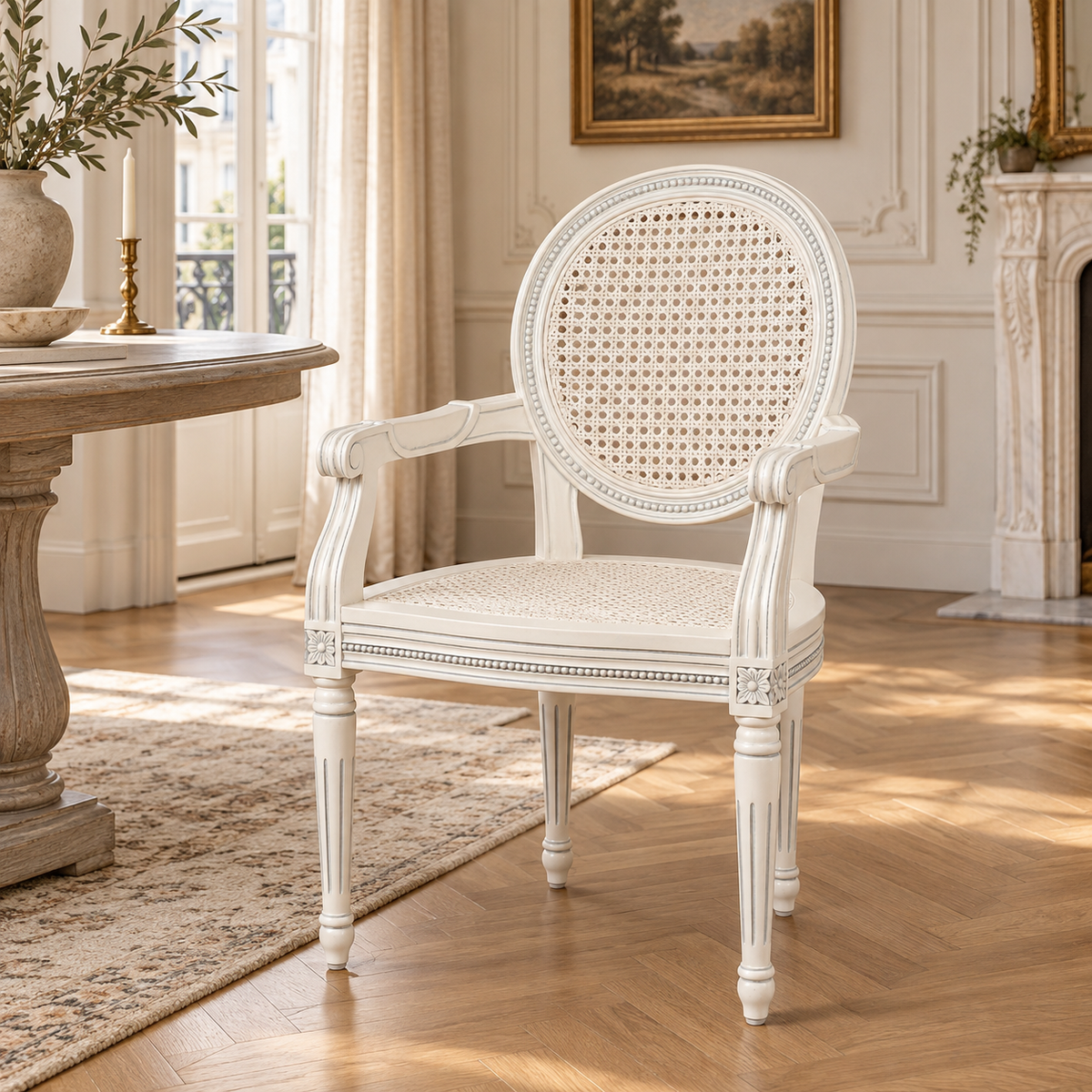 Céleste off-white French rattan dining armchair in mahogany, styled in a sunlit room with fireplace and wood floor
