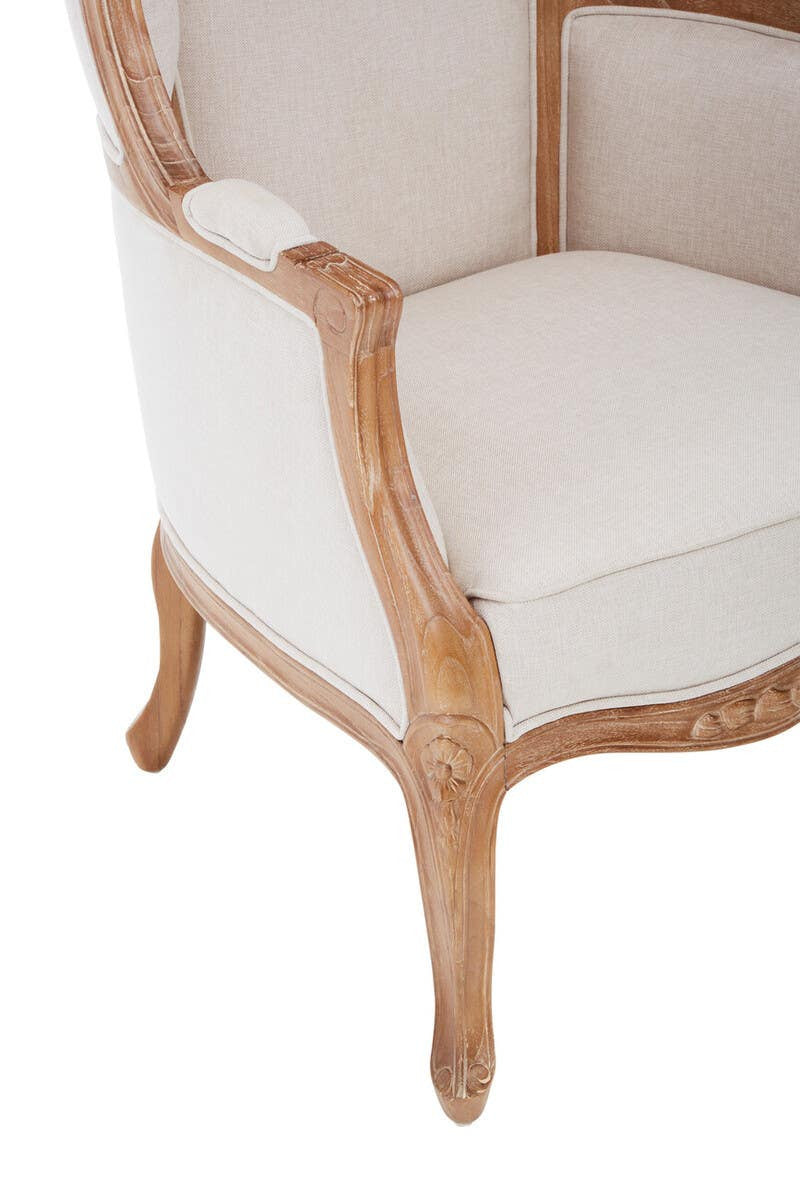 Close-up detail of the Colette Cream Dome Accent Chair with Canopy Back & Cabriole Legs featuring the plush upholstered seat, carved wooden arm, decorative floral carving and traditional French craftsmanship.