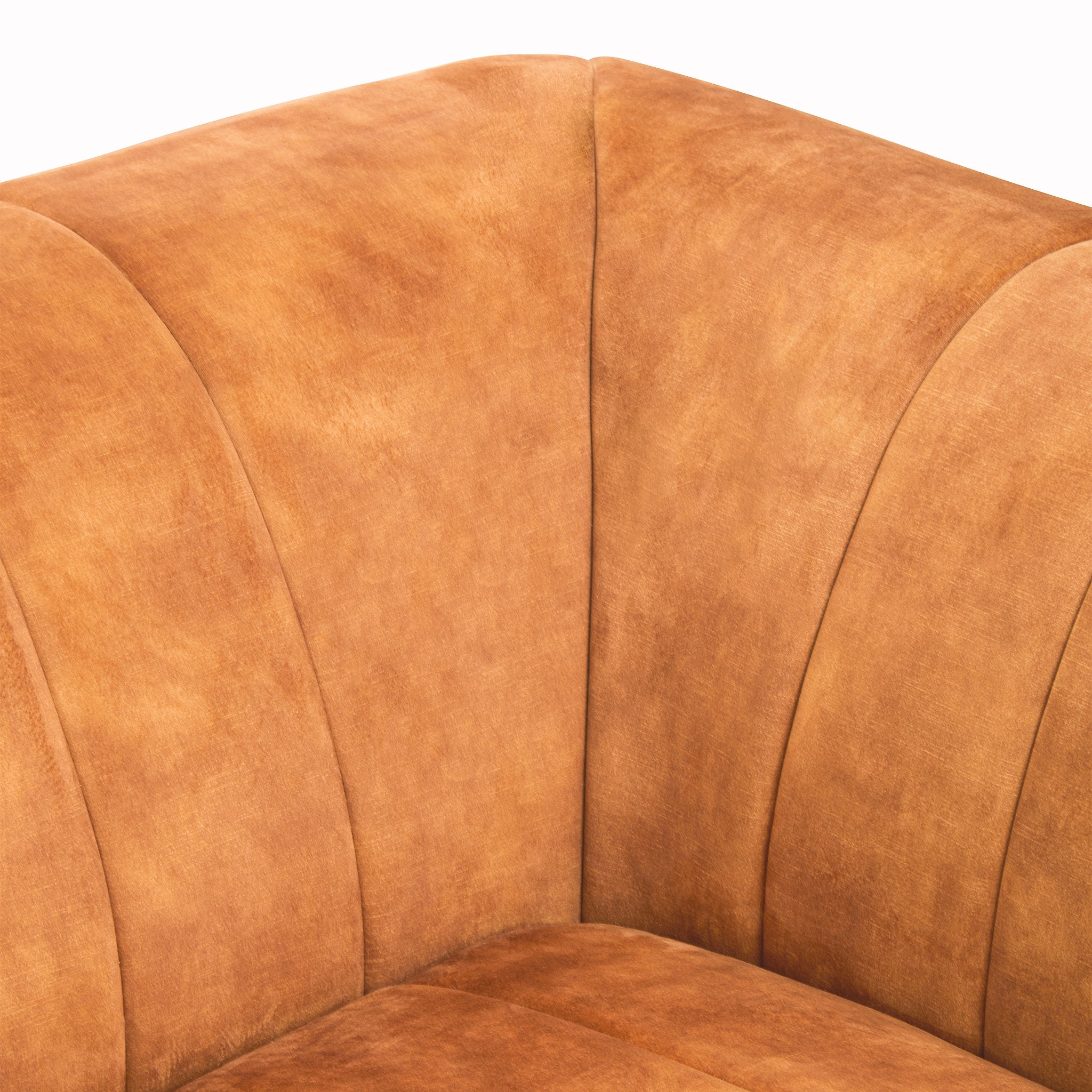 Detailed close-up of the Elara Two Seat Sofa in Gold Velvet Upholstery featuring the softly curved backrest, channel stitched velvet upholstery and luxurious contemporary design.