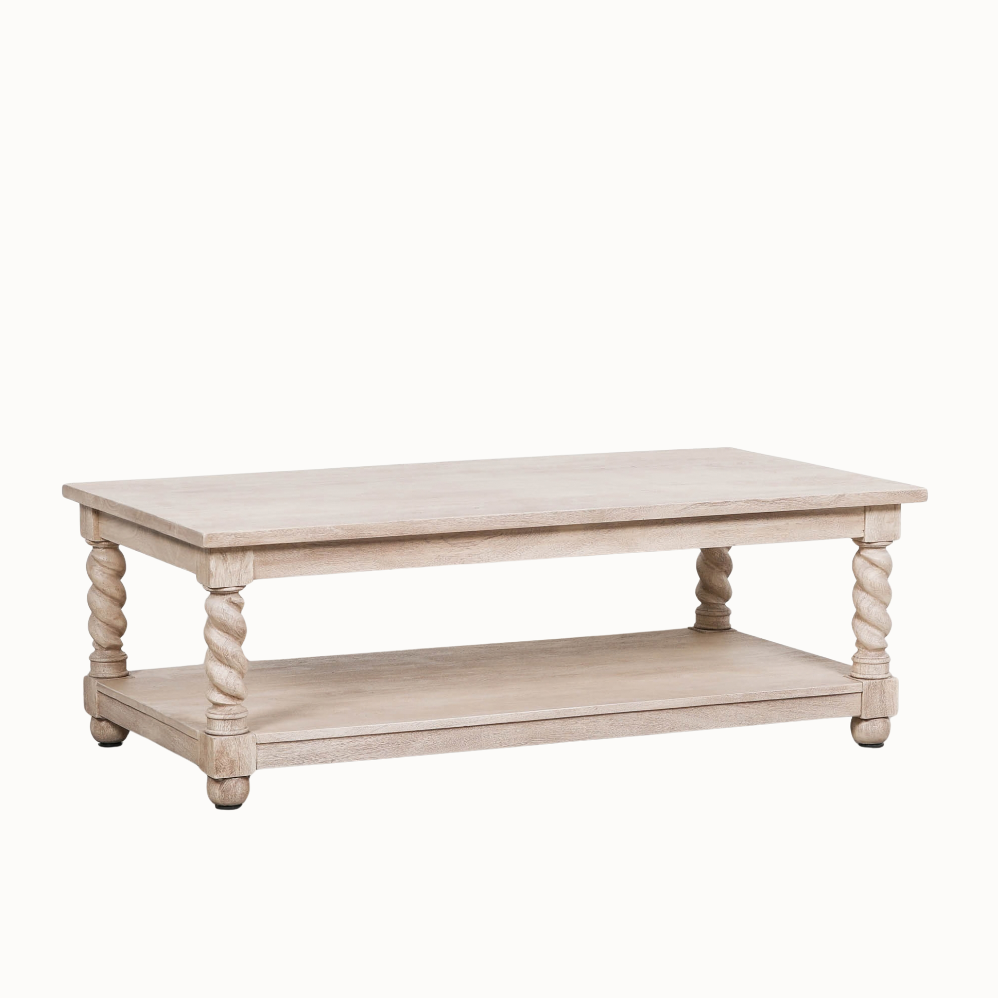 Éloi sculptural acacia wood coffee table with lower shelf and hand-carved twirl legs on a clean white background.