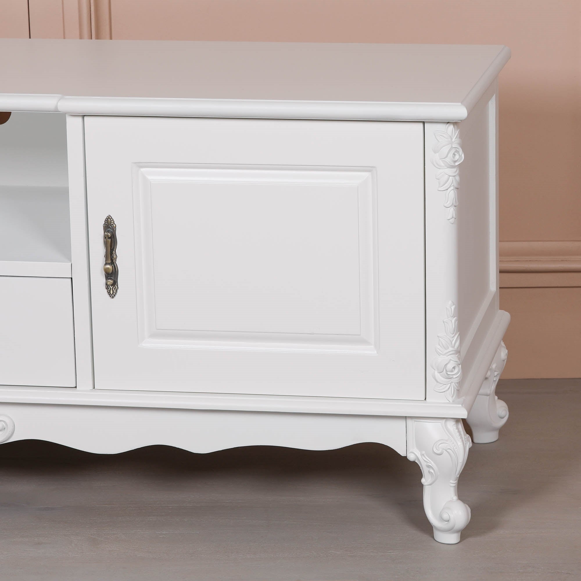 Close-up of the Éloise Large French White TV Cabinet highlighting hand-carved floral detailing, ornate cabriole legs, decorative brass handle and premium white painted wood finish.