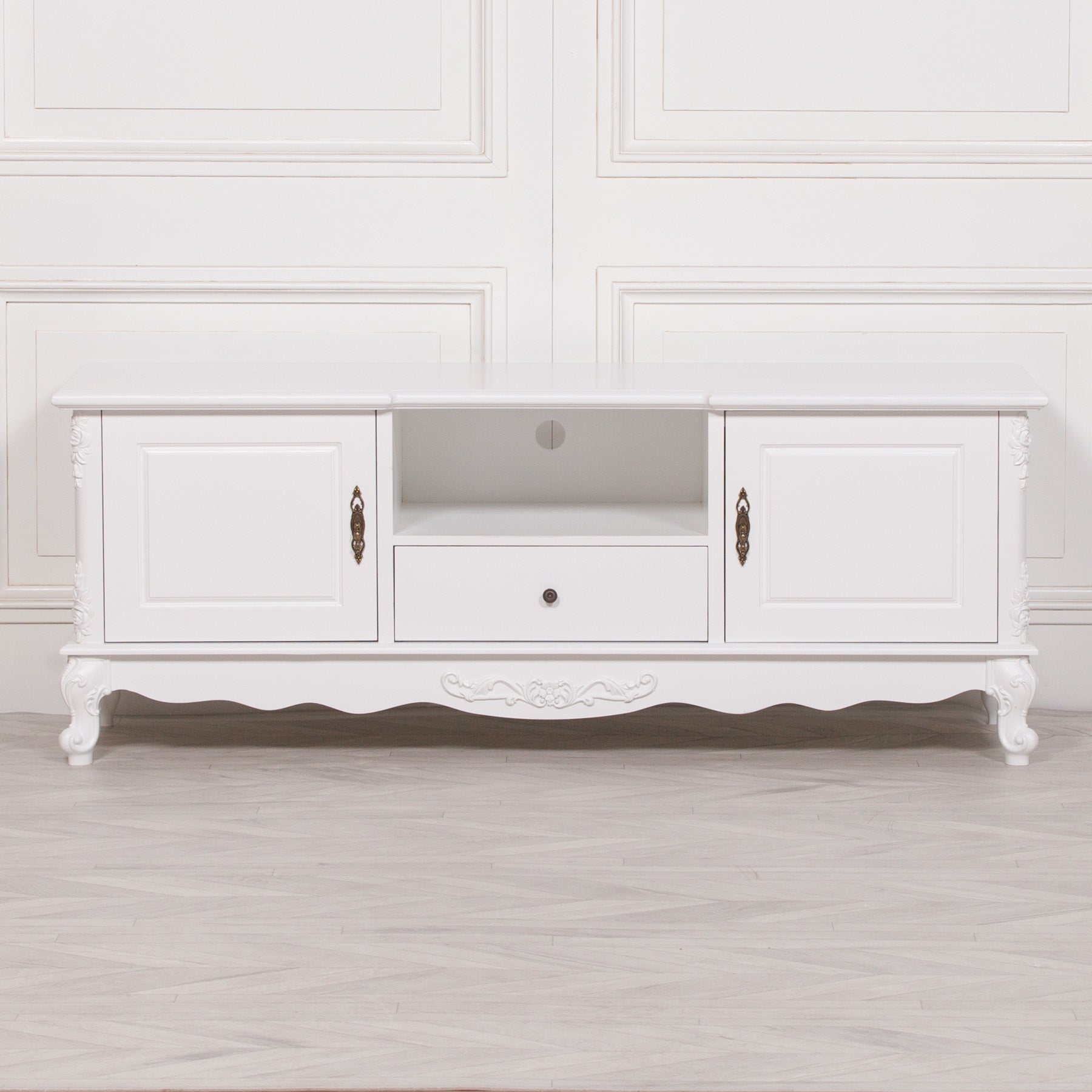 Front elevation of the Éloise Large French White TV Cabinet featuring two cupboard doors, central drawer, open entertainment shelf and hand-carved French-inspired detailing.