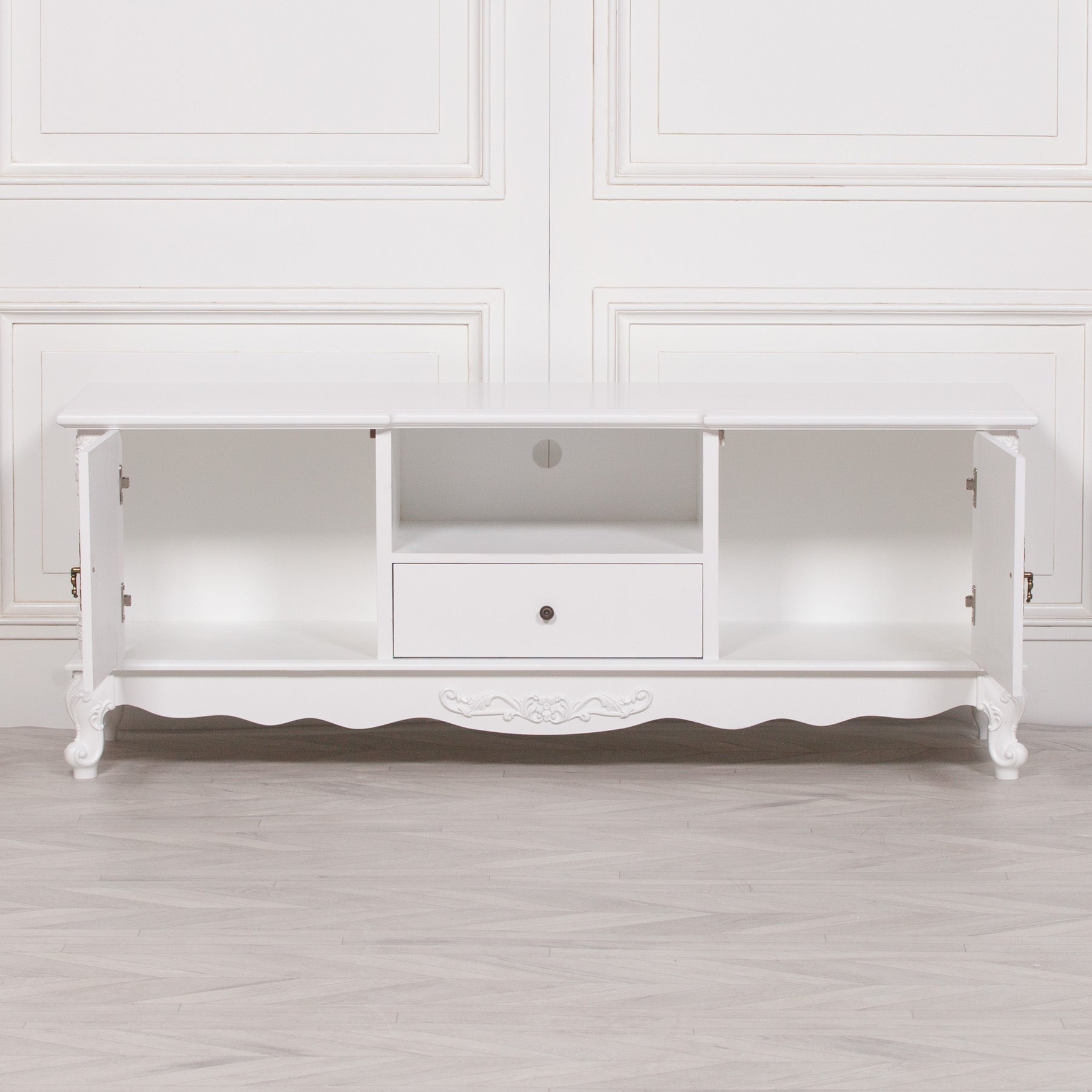 Éloise Large French White TV Cabinet fully opened to reveal spacious internal cupboard storage, media shelf, cable management opening and practical living room organisation.