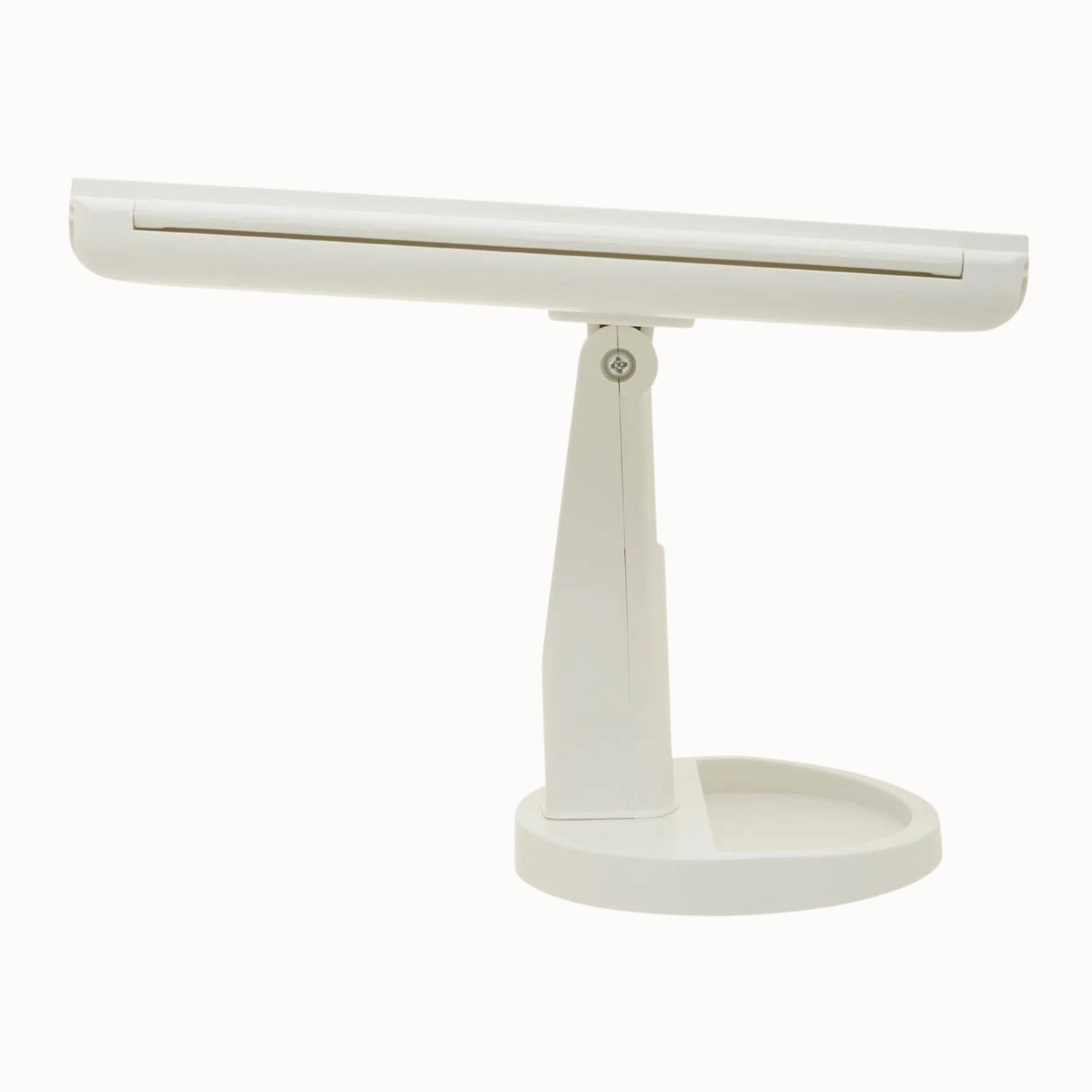 Rear side view of Émile white LED vanity mirror showing slim frame, stand and round base on a plain white background.