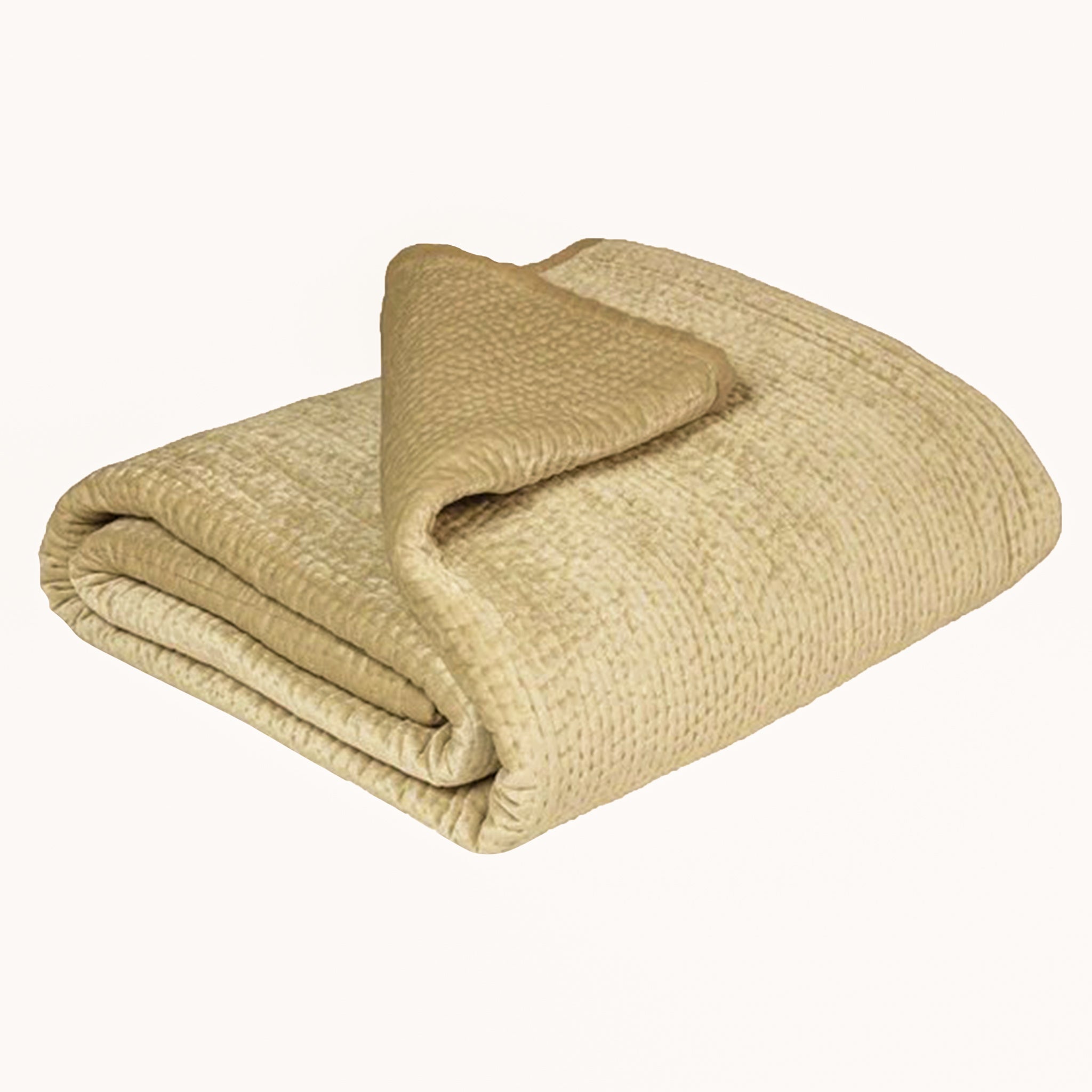 Folded Émilie quilted champagne bedspread showing its textured woven surface and smooth linen border, a neutral bedding design for elegant bedroom interiors.
