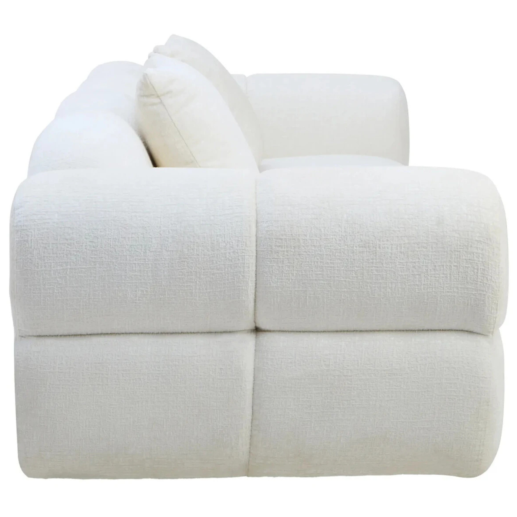 Side profile of Éveline cream textured fabric 3 seater sofa showing its deep seat and rounded arm on a white background.