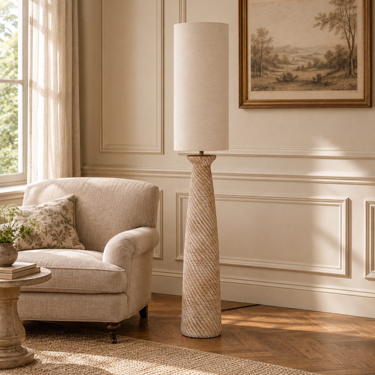 Florent 163cm brown resin floor lamp with white linen shade beside a beige armchair in a sunlit living room.