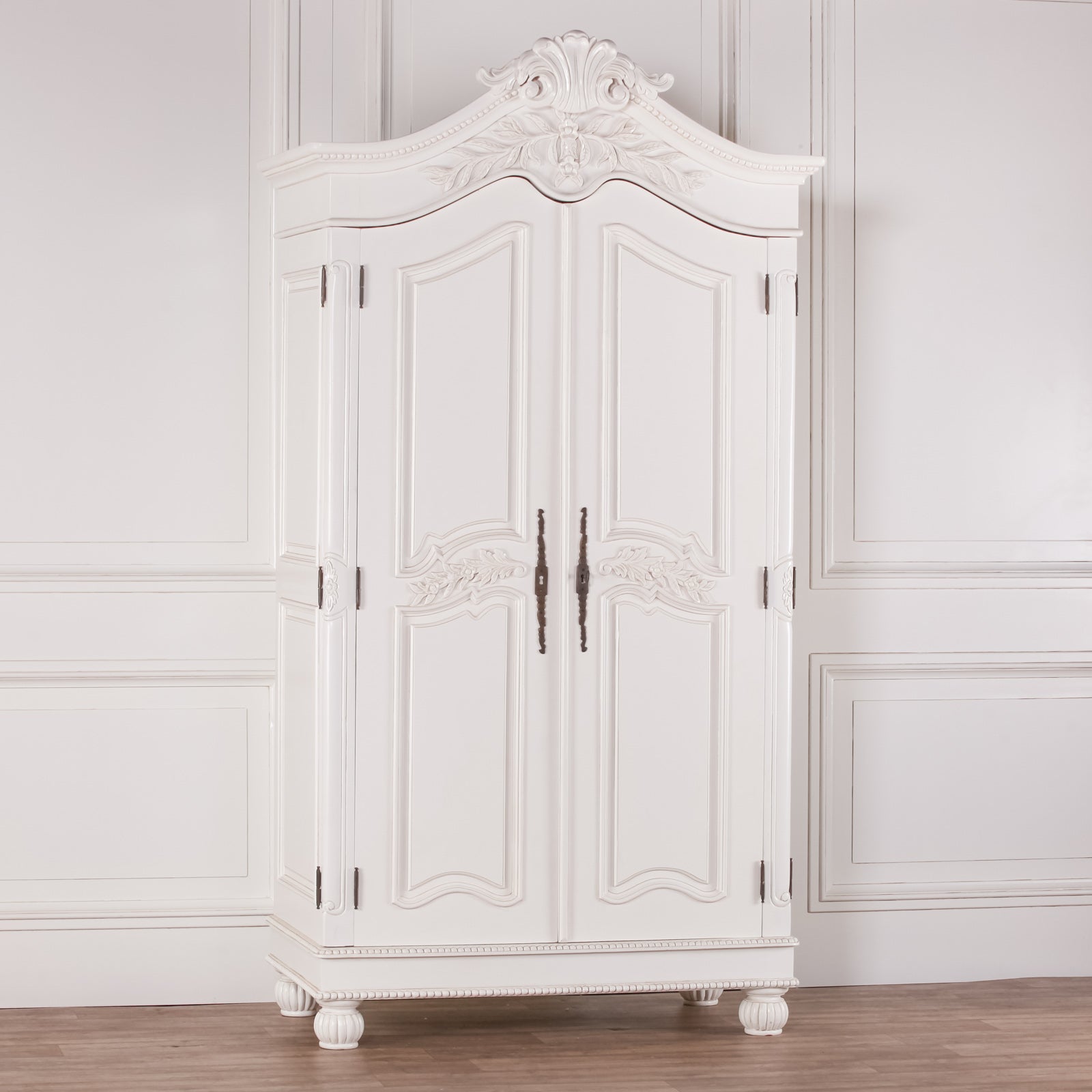 Geneviève Hand-Carved French Chateau Double Door Armoire Wardrobe in White Mahogany displayed in a bright French-inspired bedroom showcasing elegant proportions, carved detailing and luxury wardrobe storage.