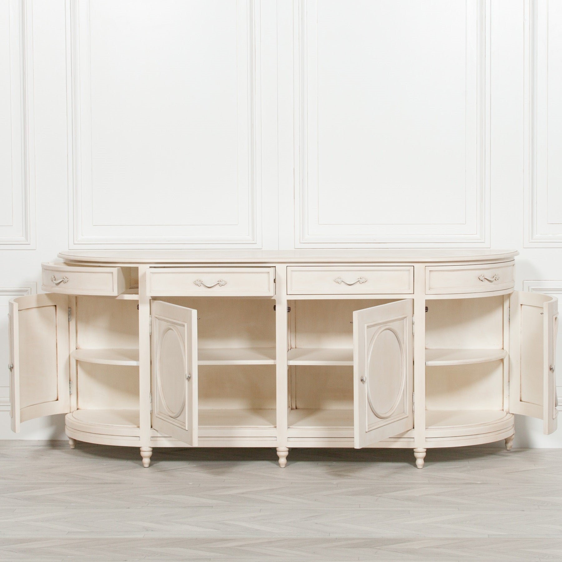 Geneviève Large Aged Ivory Sideboard with 4 Doors, 4 Drawers & Ornate Detailing shown with all cabinet doors open, displaying generous internal shelving, curved end storage compartments and practical concealed storage for dining or living rooms.