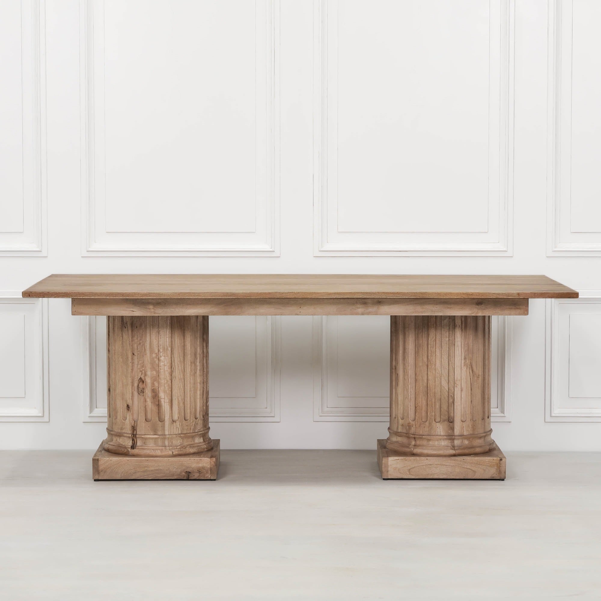 Front view of the Henri 220cm Rustic Mango Wood Rectangular Column Dining Table on a white background, showcasing the solid mango wood tabletop, twin fluted column pedestal bases, rustic finish and generous dining surface for 8 to 10 guests.