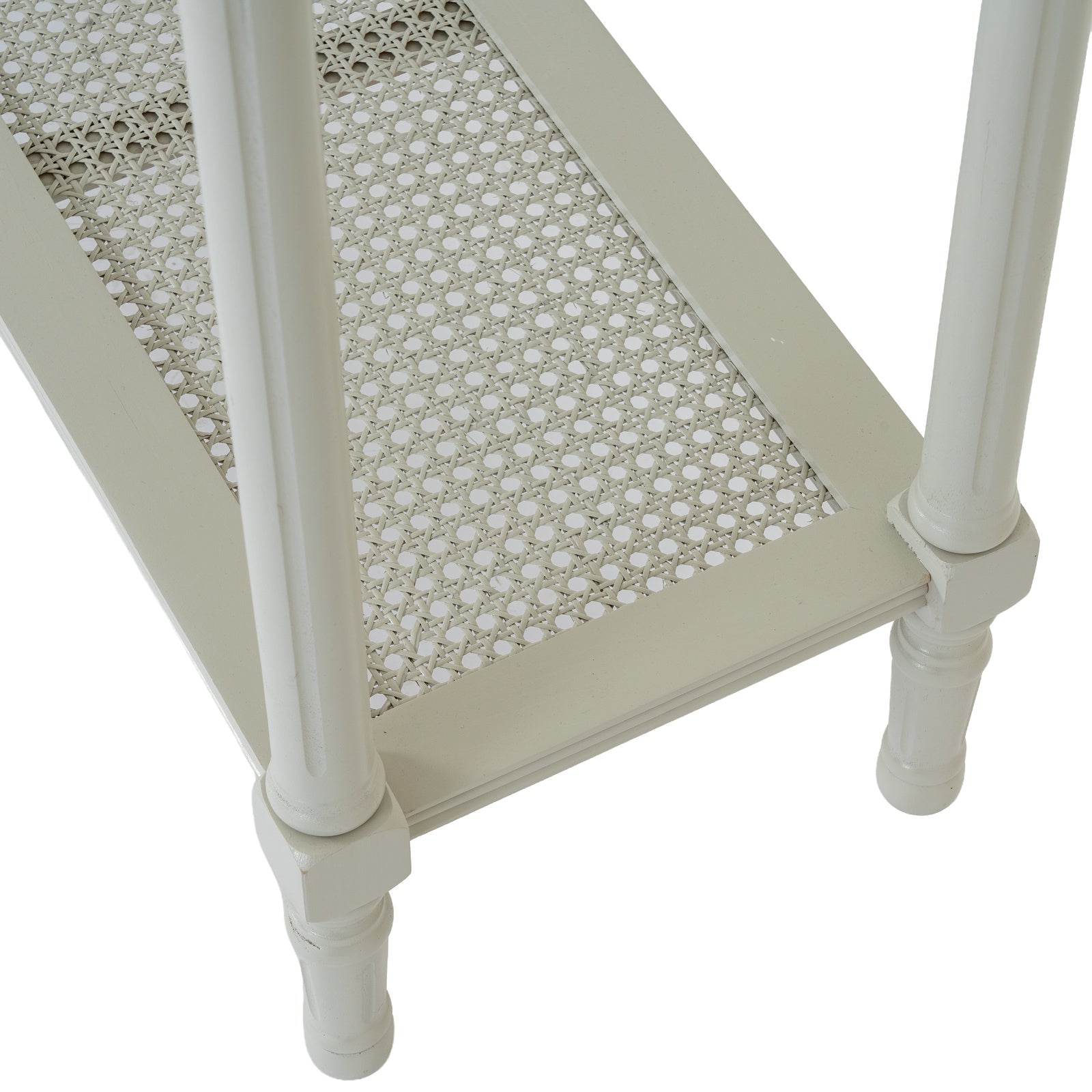 Close-up of the Juliette white rattan console table showcasing the handwoven rattan lower shelf, painted white frame and turned wooden legs, highlighting its natural woven detailing and practical storage design.