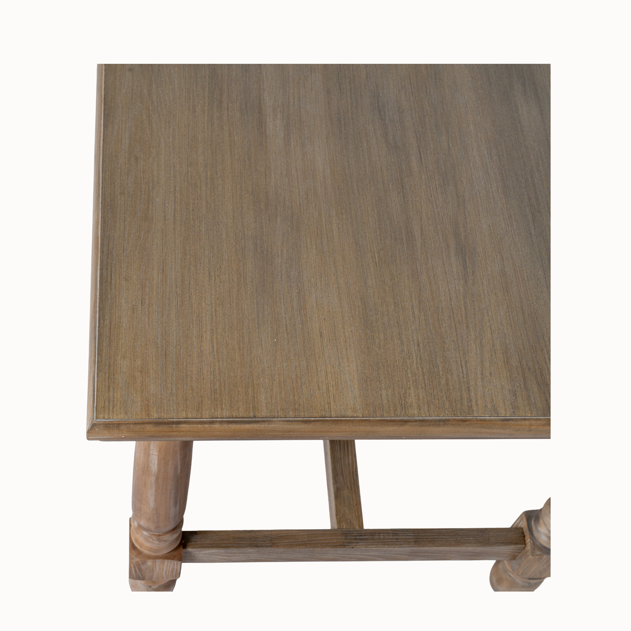 Close-up of Laurent brown wood dining table showing the wood grain tabletop and edge detail on a white background.