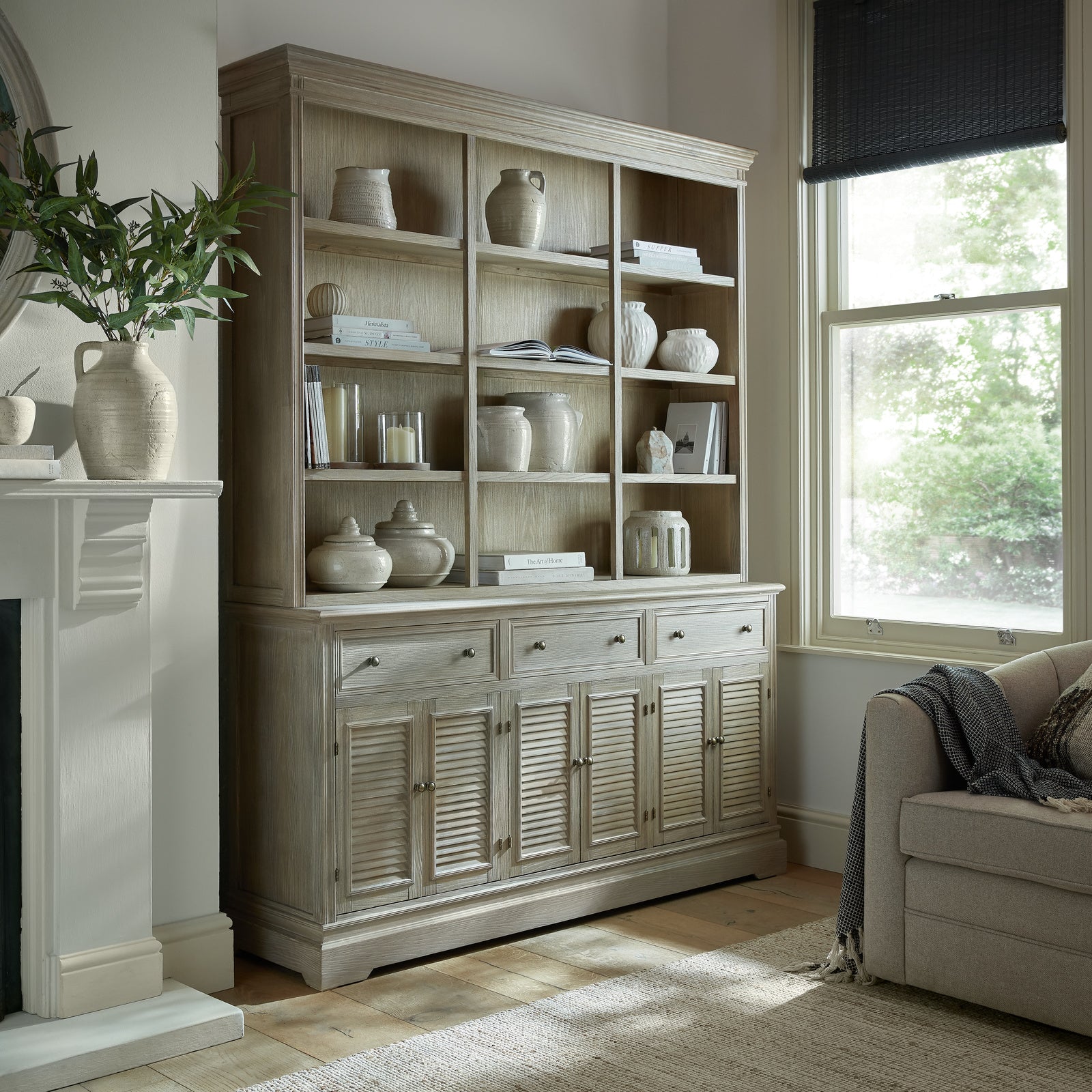 Laurent Large Wood Display Cabinet Set with open display shelving styled in an elegant living room, featuring spacious wooden shelving, lower storage cupboards and timeless French-inspired design for displaying books, ceramics and home décor.