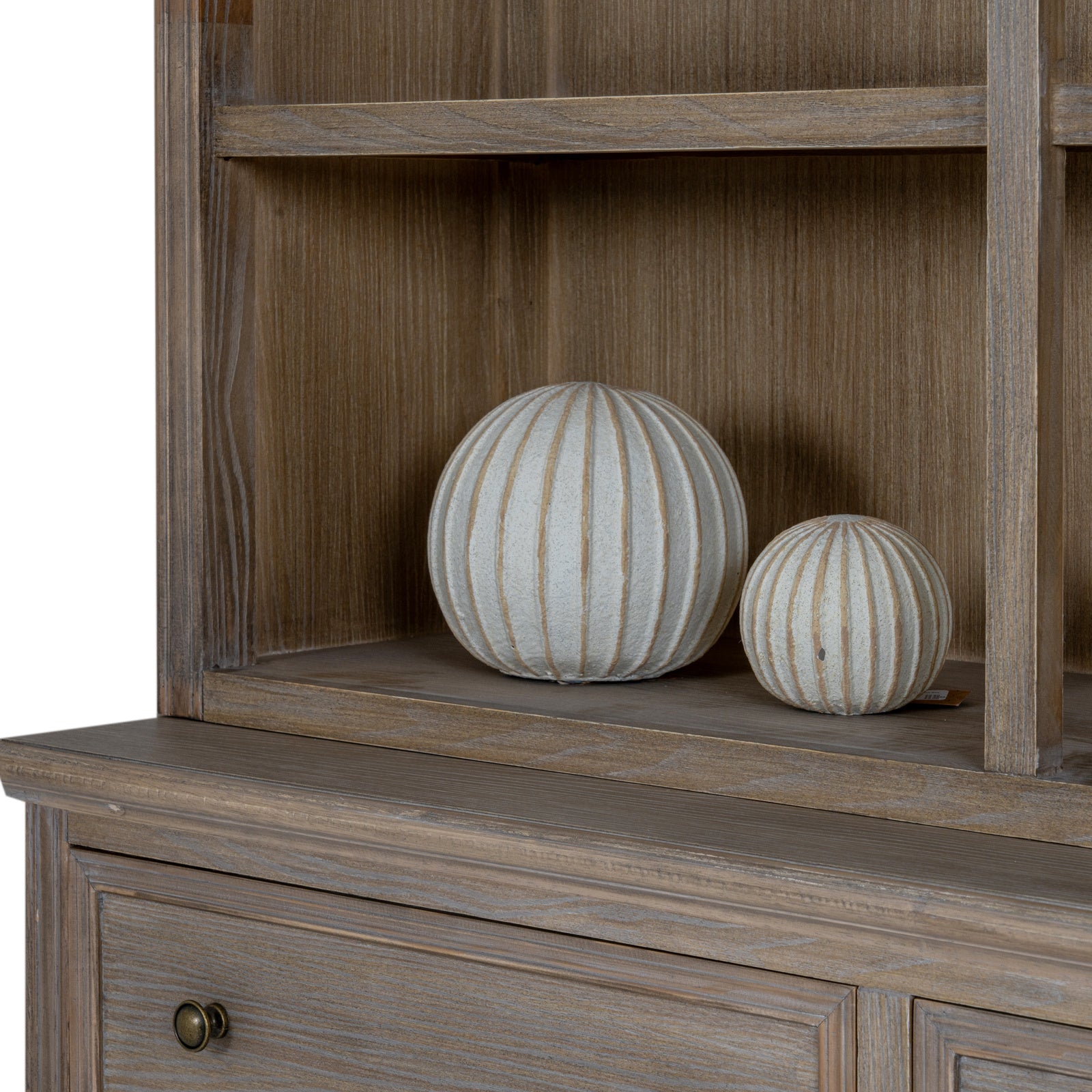 Styled shelf detail of the Laurent Large Wood Display Cabinet featuring decorative ceramic ornaments displayed on spacious open wooden shelving.