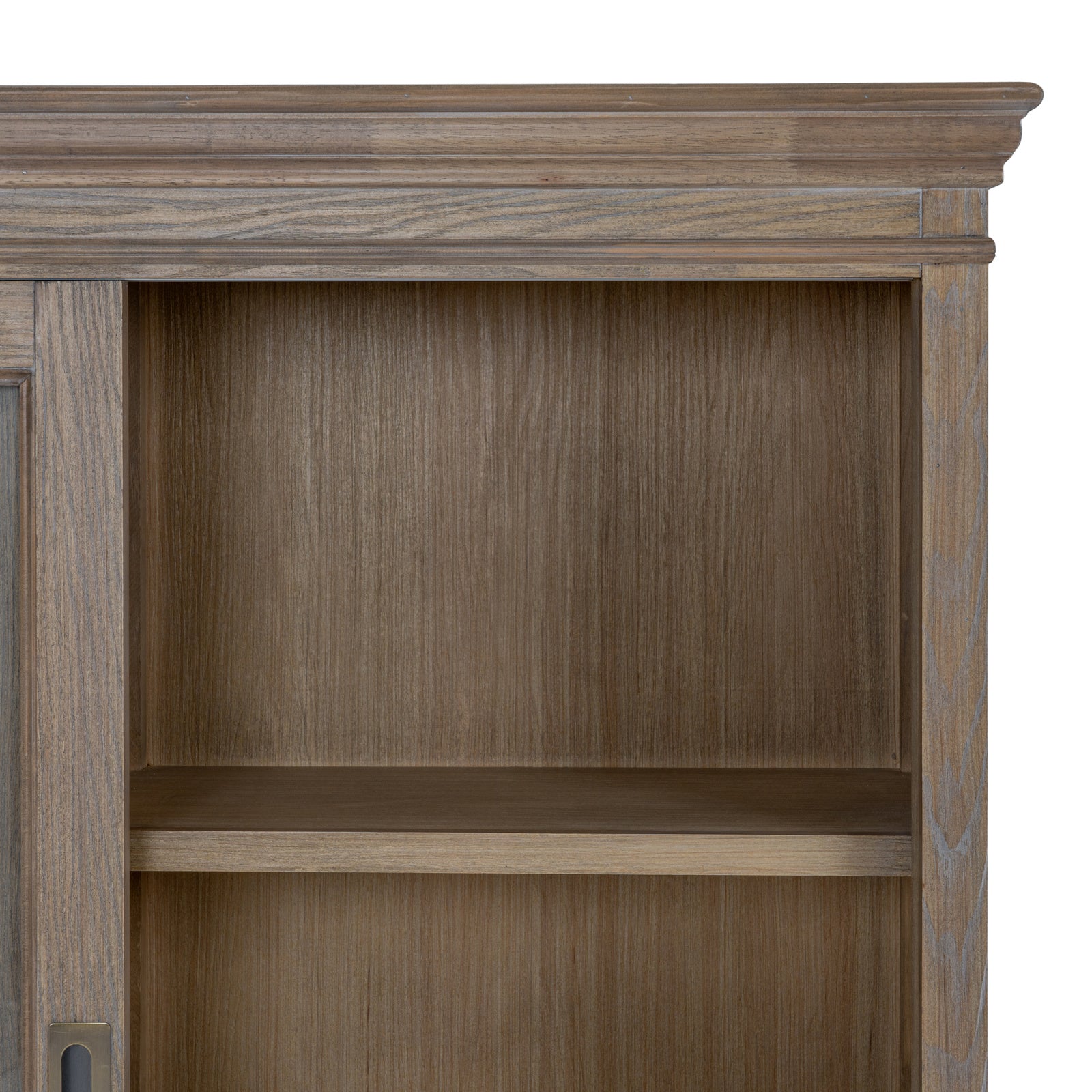 Close-up of the Laurent Sliding Glass Dresser Cabinet Top highlighting the moulded cornice, natural wood grain, handcrafted finish and spacious display shelving behind sliding glass doors.