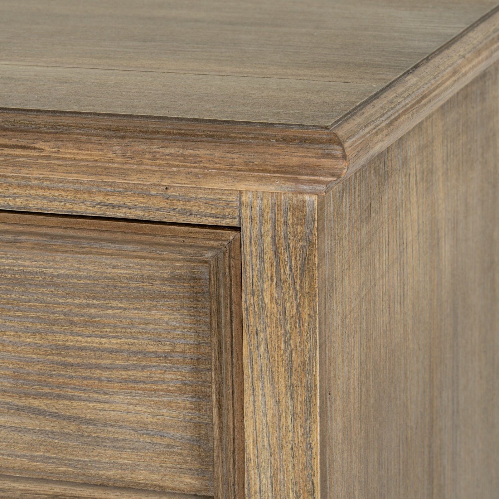 Detailed close-up of the Laurent Wood Chest of Drawers with 3 Drawers showcasing the natural wood finish, moulded top edge, solid construction and beautifully textured timber grain.