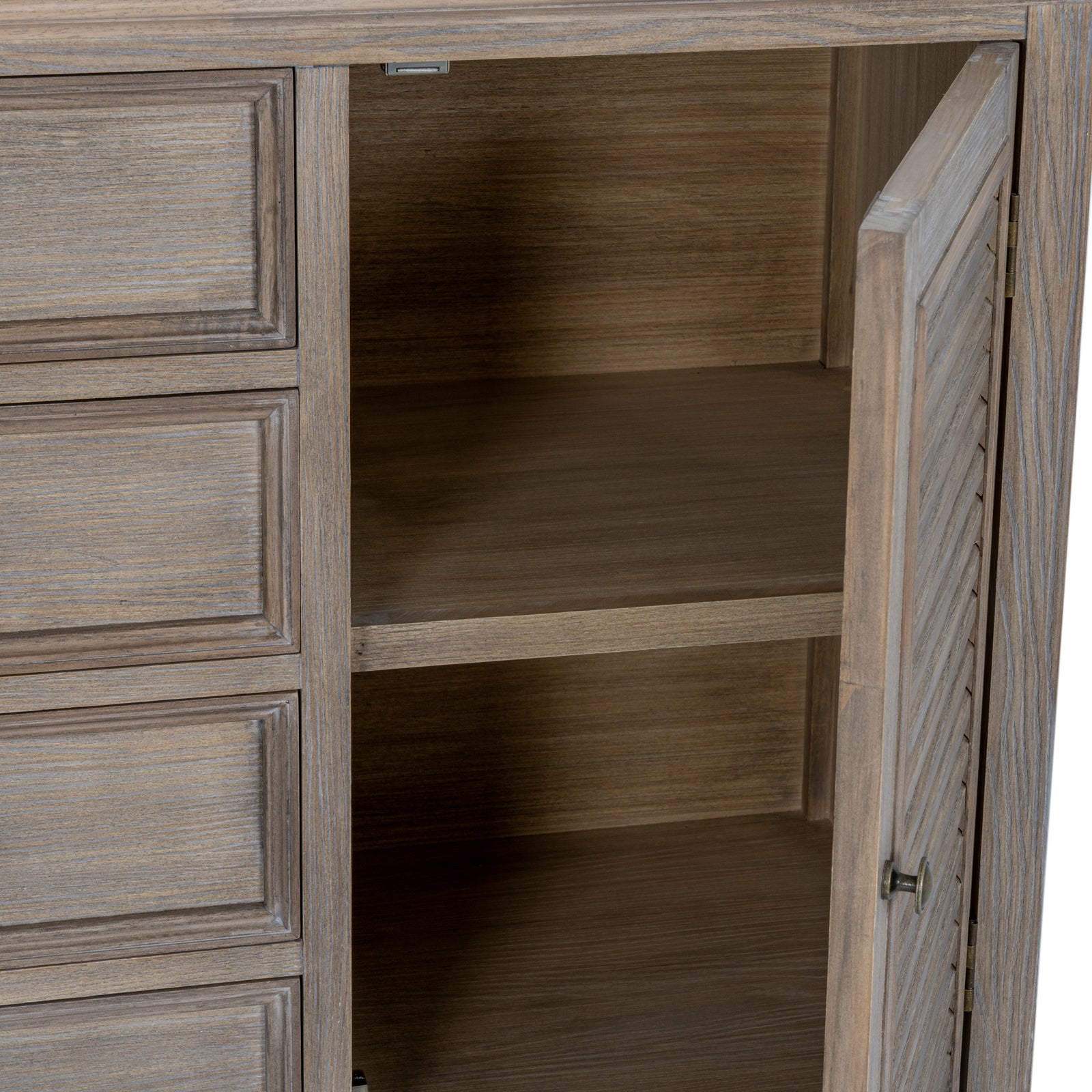 The Laurent Wood Display Cabinet Set matching sideboard with cupboard door open, revealing spacious internal shelving, concealed storage and natural wood cabinet interior.