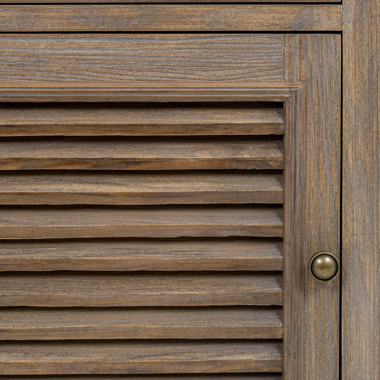 Detailed close-up of the Laurent Wood Storage Chest with 1 Door & 1 Drawer – Left Hand highlighting the louvred shutter-style cabinet door, antique brass knob, natural wood grain and premium craftsmanship.