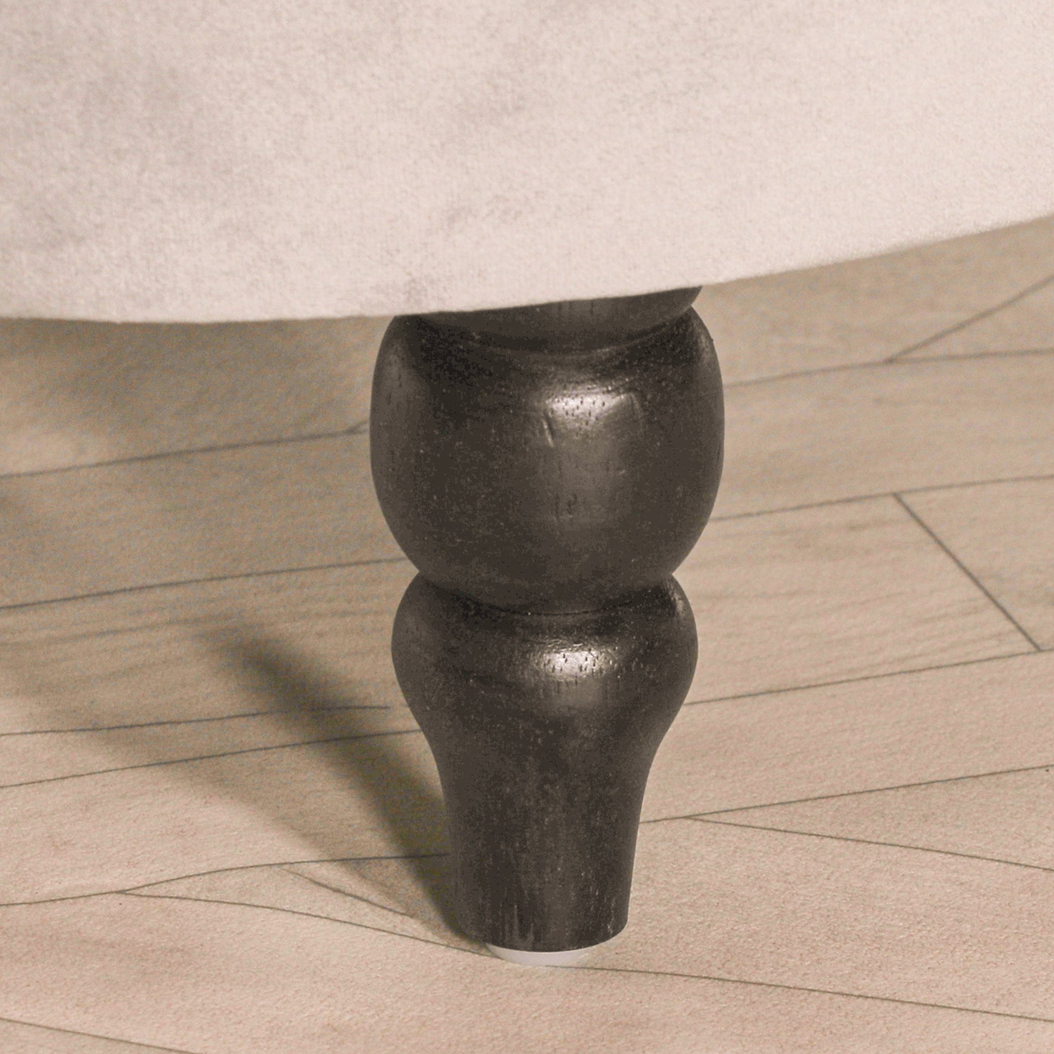 Close-up of the turned black wooden leg on the Lucien Grey Velvet Upholstered Bedroom Bench, showcasing the premium craftsmanship, sturdy construction and elegant furniture detailing.