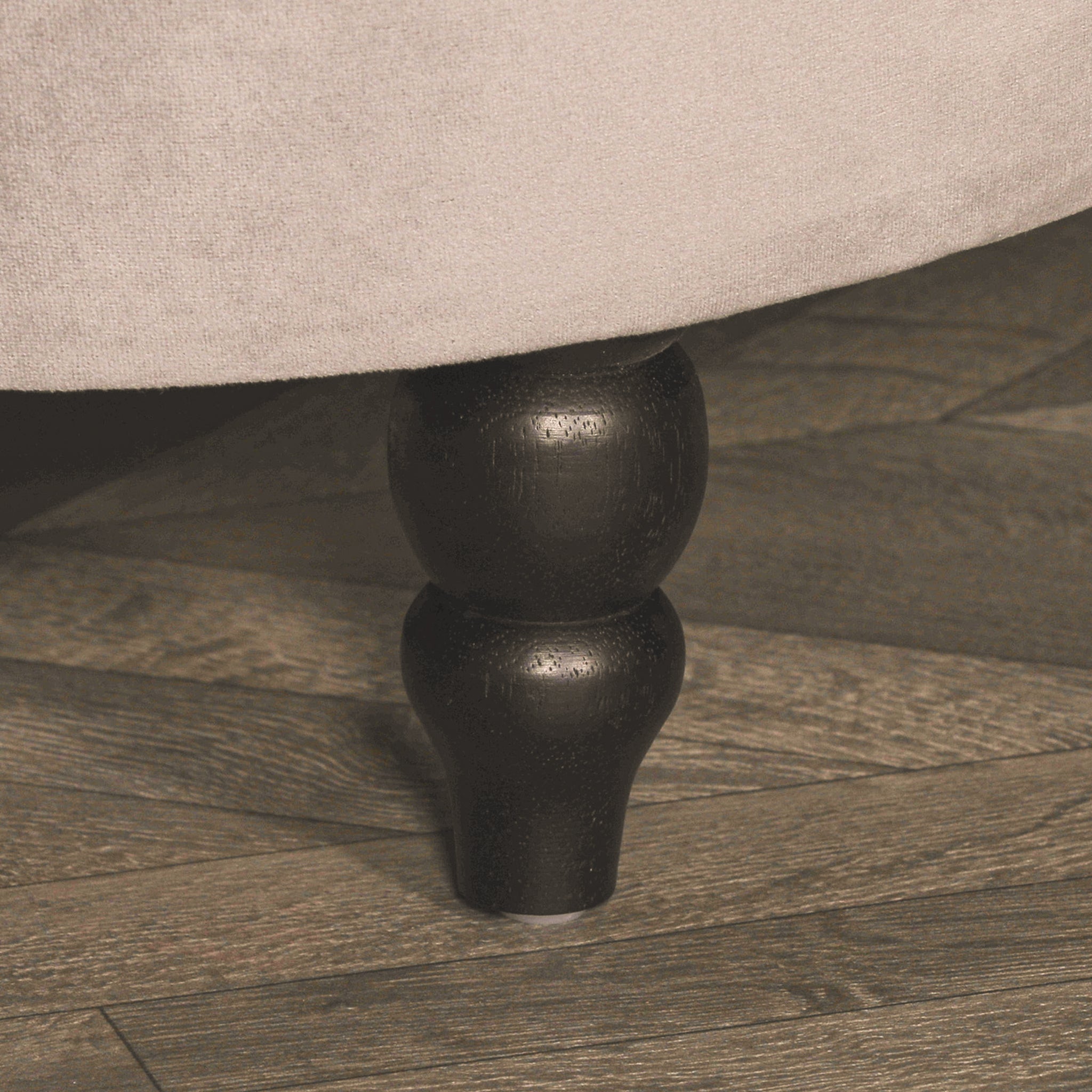 Detailed close-up of the black turned wooden leg and soft grey velvet upholstery on the Lucien Grey Velvet Upholstered Bedroom Bench, highlighting its premium finish and durable craftsmanship.
