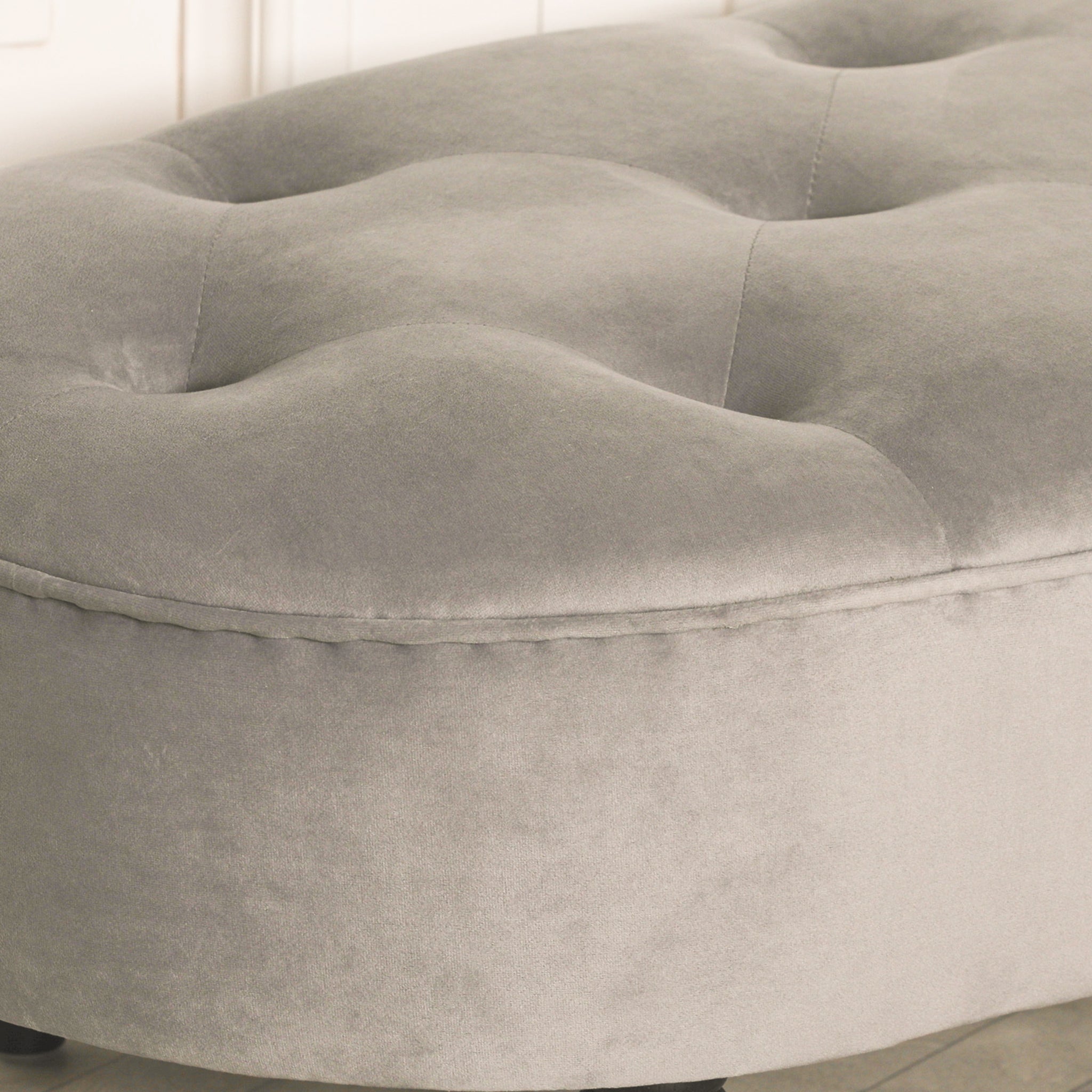 Detailed close-up of the Lucien Grey Velvet Upholstered Bedroom Bench highlighting the luxurious button tufted velvet upholstery, soft padded seat and premium finish for sophisticated bedroom interiors.