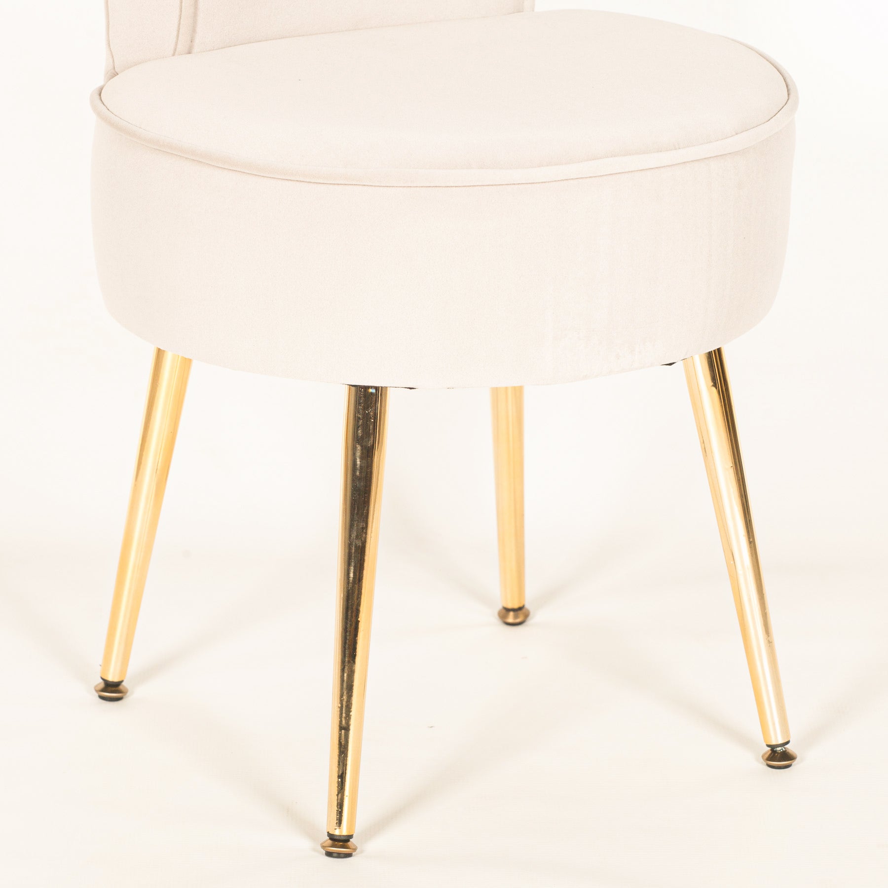Detailed close-up of the Lucien Light Grey Velvet Accent Bedroom Chair with Gold-Plated Legs showcasing the upholstered velvet seat, tailored finish and polished tapered gold-plated metal legs.
