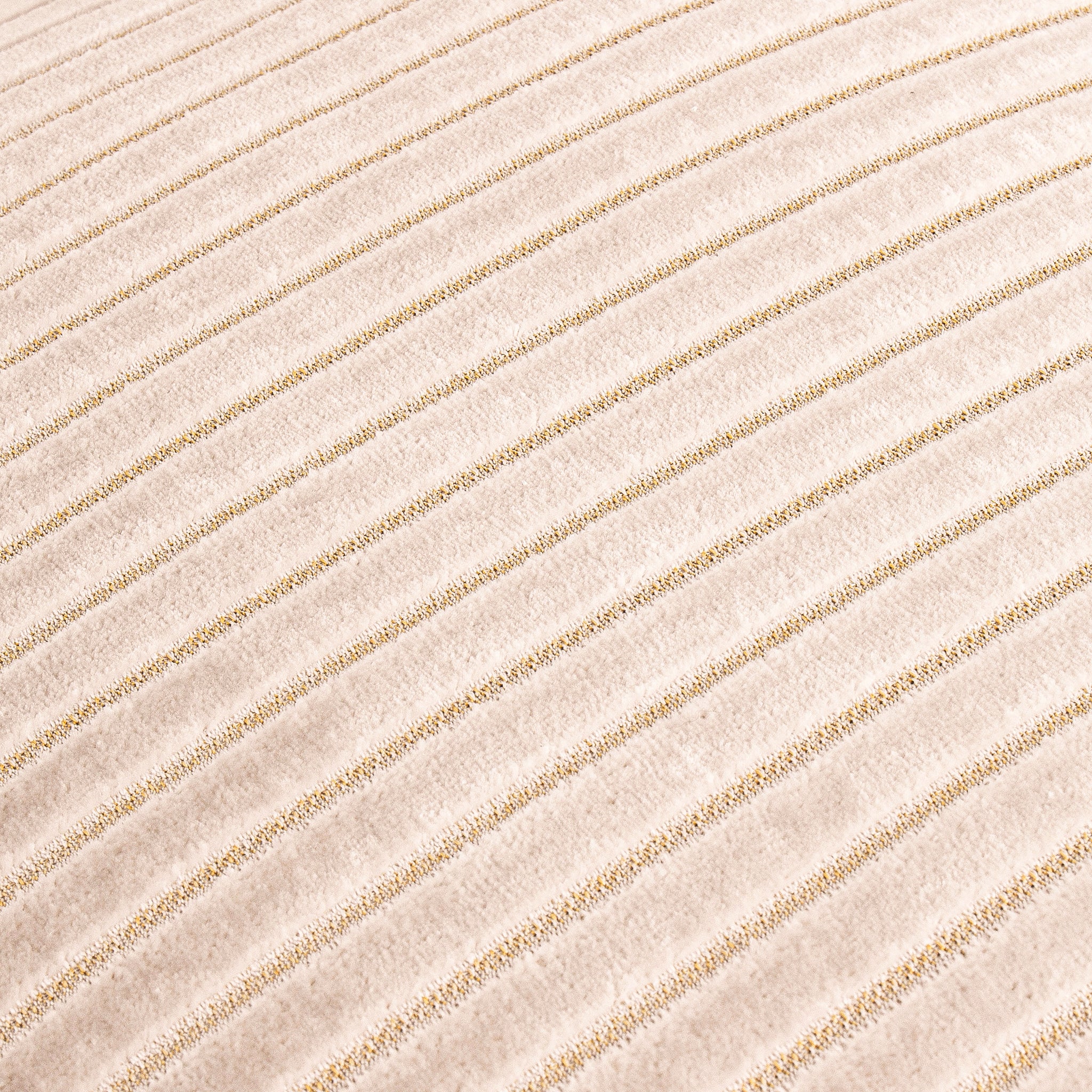 Close-up of the Maëva Cut Velvet Striped Cushion in Oyster Cream showing the luxurious cut velvet texture, raised striped detailing and subtle metallic woven accents for a premium decorative cushion finish.