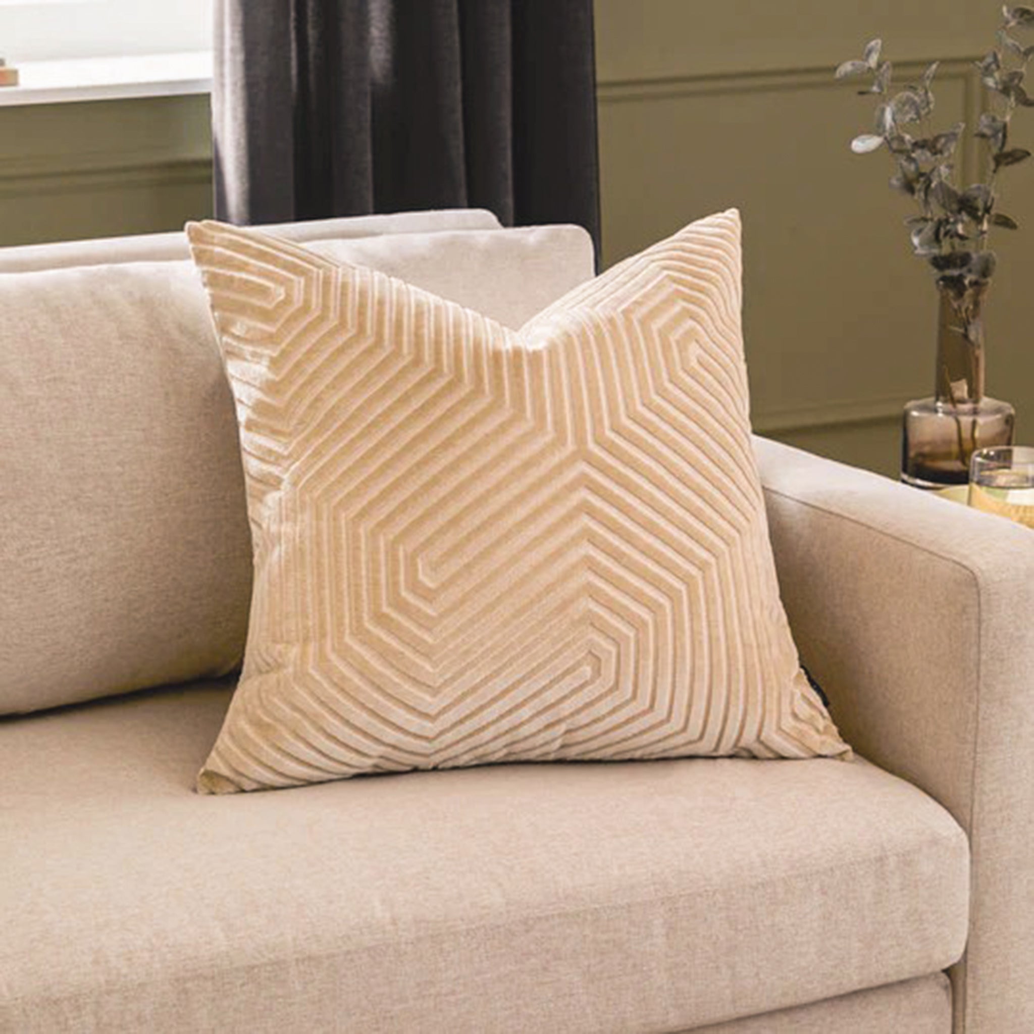 Maëva Geometric Cut Velvet Cushion in Ivory styled on a neutral sofa, featuring a raised linear geometric pattern and soft velvet texture for an elegant living room.
