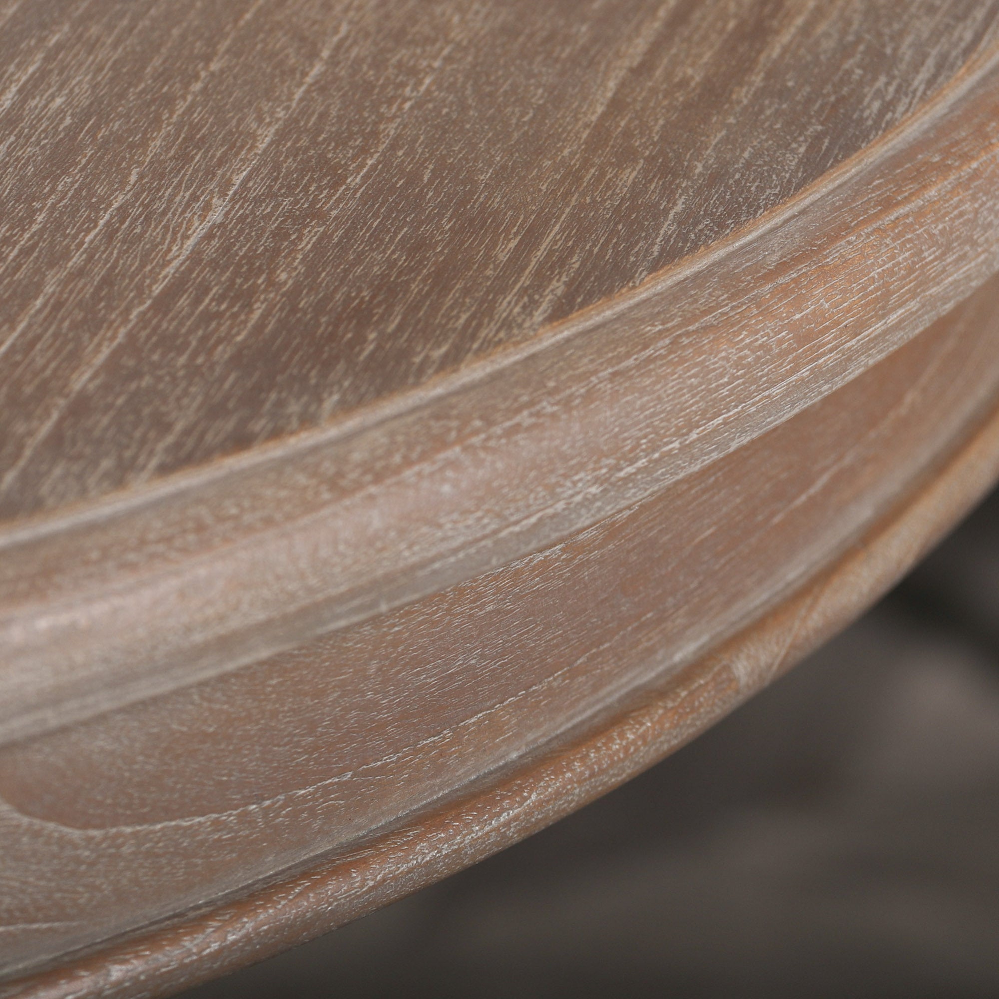 Close-up of the reclaimed cedar wood tabletop edge with visible natural wood grain on the Mathis round dining table.
