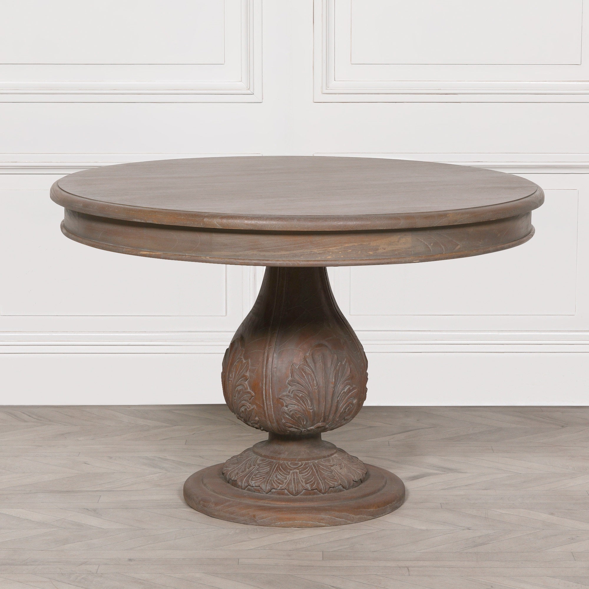 Mathis round pedestal dining table 120cm crafted from reclaimed cedar wood with a hand-carved acorn pedestal base and dark rustic finish.