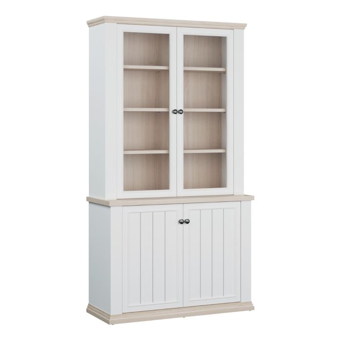 Angled view of the Montclair tall 4 door display cabinet in white and oak effect, with two glazed upper doors, display shelving and two lower storage cupboard doors.
