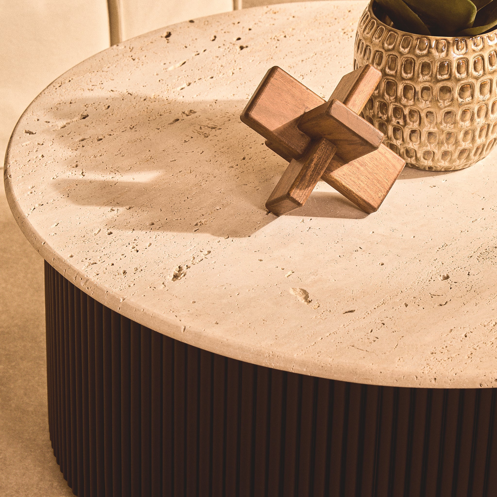 Front angled view of the Noé hand-carved brown acacia wood sculptural object showing its interlocking geometric wooden form