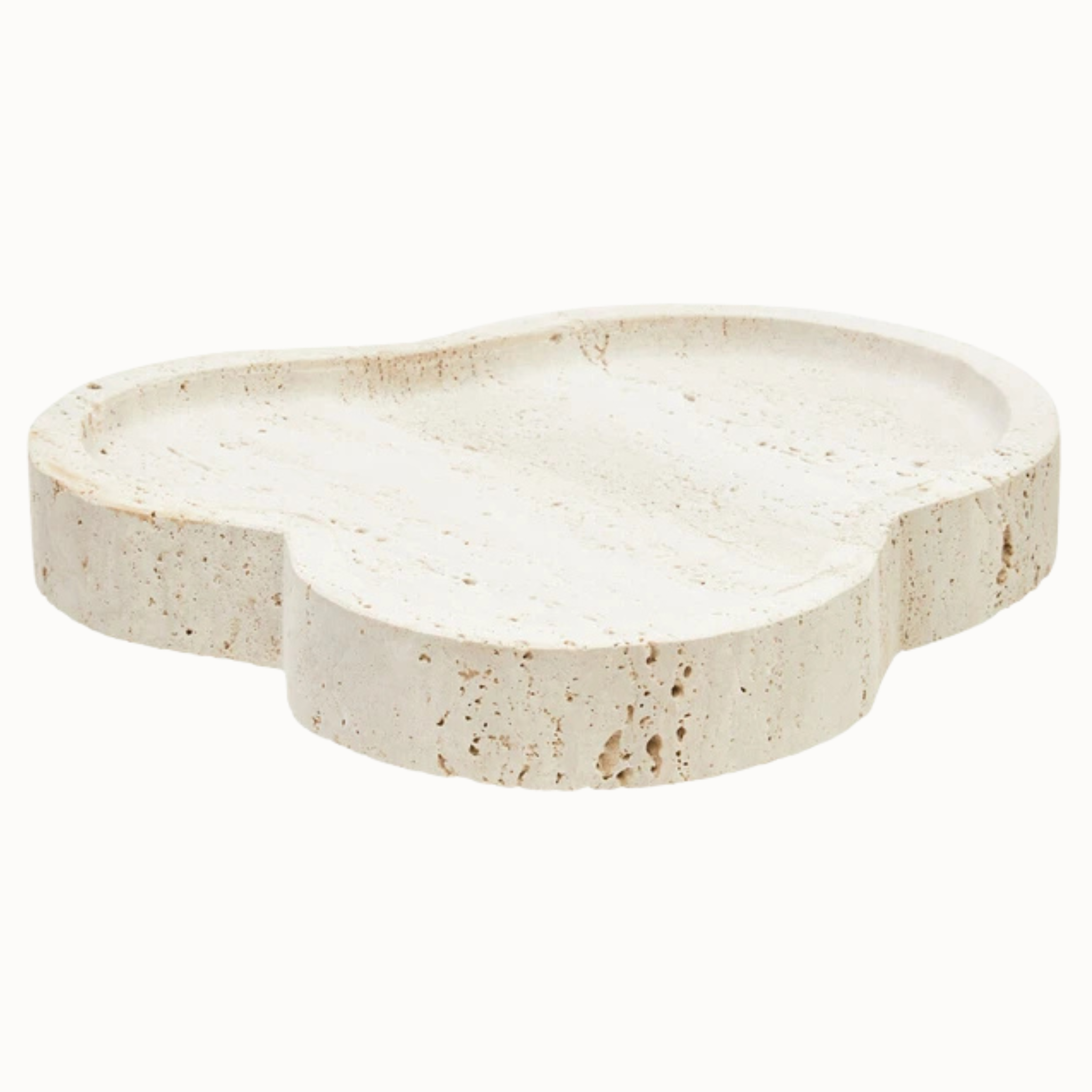 Noé irregular travertine decorative tray with sculpted curves and porous stone finish on a white background.