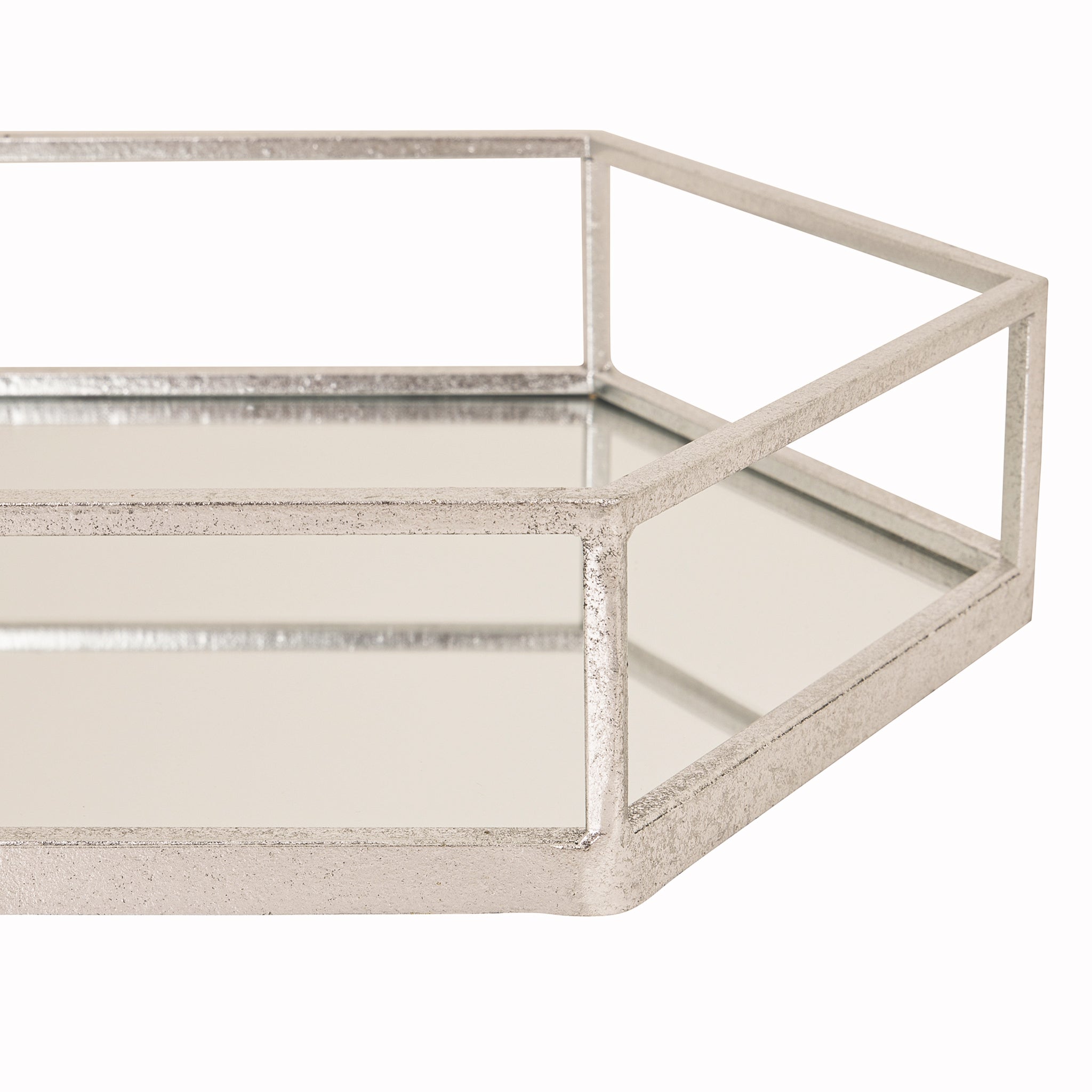 Detailed corner view of the Noé silver metal and glass hexagon tray highlighting the durable silver metal frame, mirrored glass surface and elegant geometric construction for modern home styling.