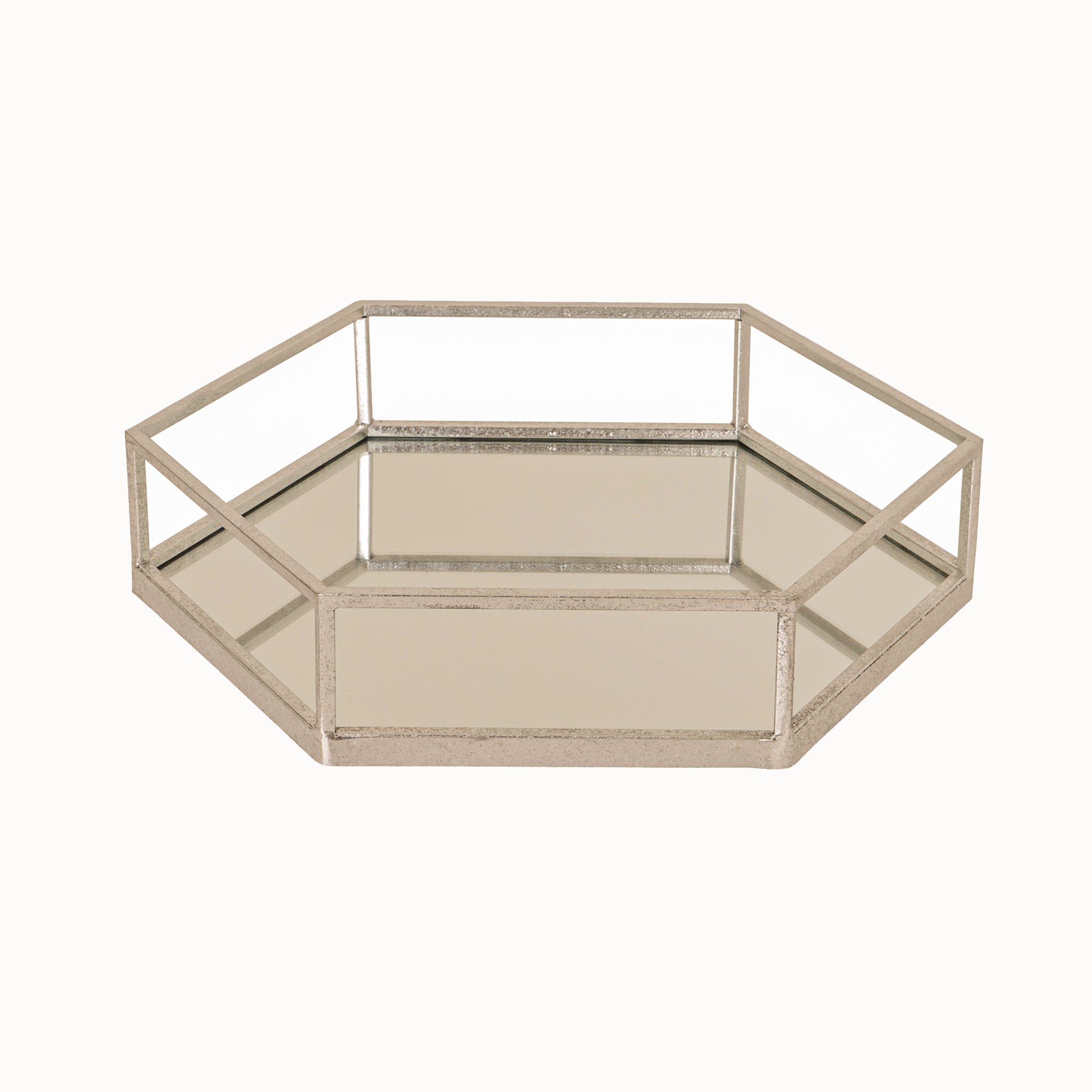 Noé silver metal and glass hexagon decorative tray featuring a mirrored glass base, geometric hexagonal design and elegant silver metal frame, ideal as a luxury coffee table tray, vanity tray or decorative home accessory.