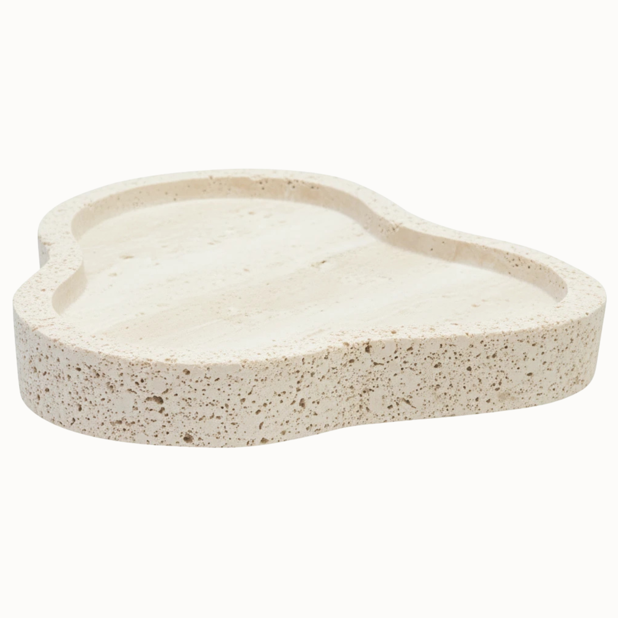 Noé irregular travertine tray with sculpted rim, beige stone grain and porous texture on a white background.