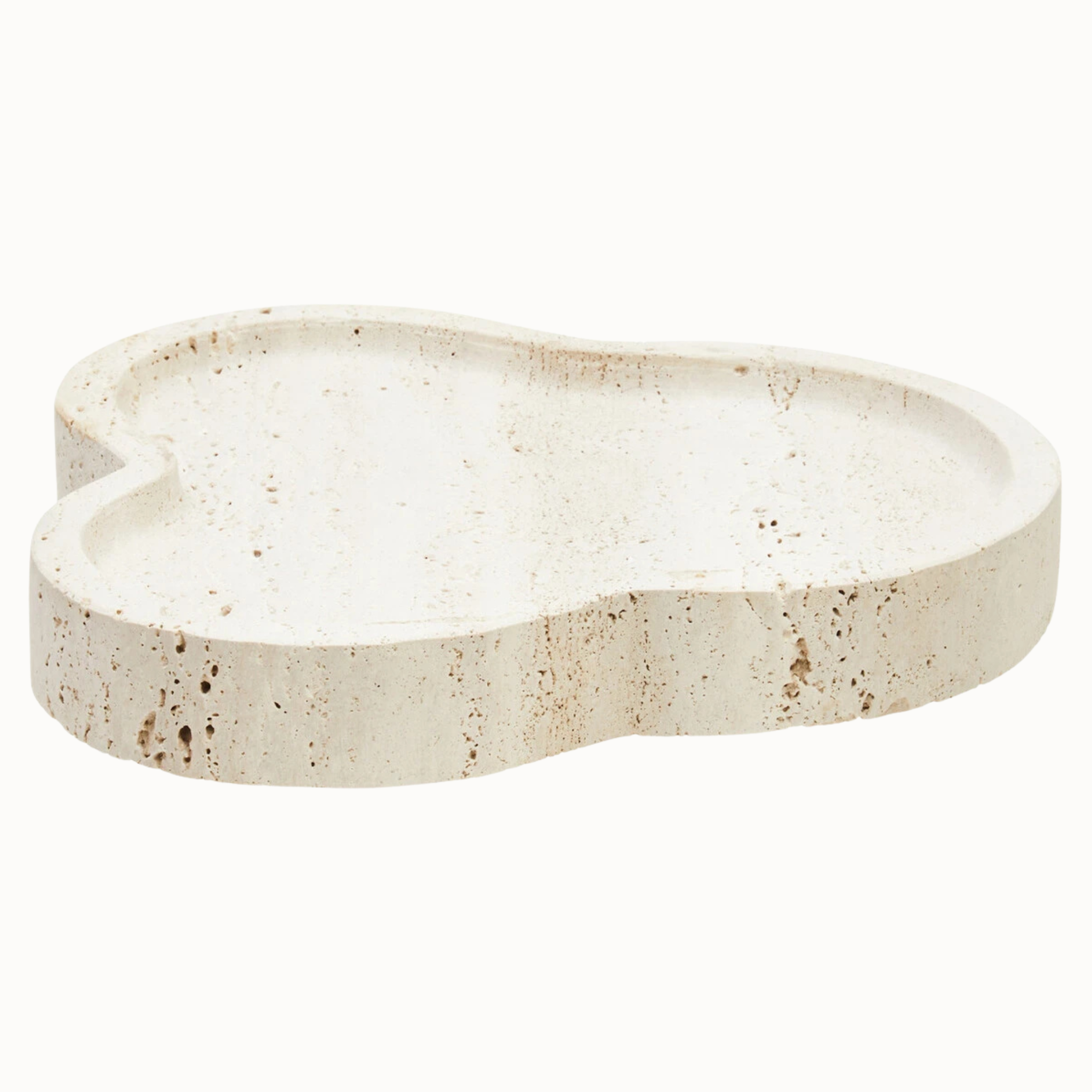 Noé travertine decorative tray with irregular organic shape, raised edge and natural beige stone on white.