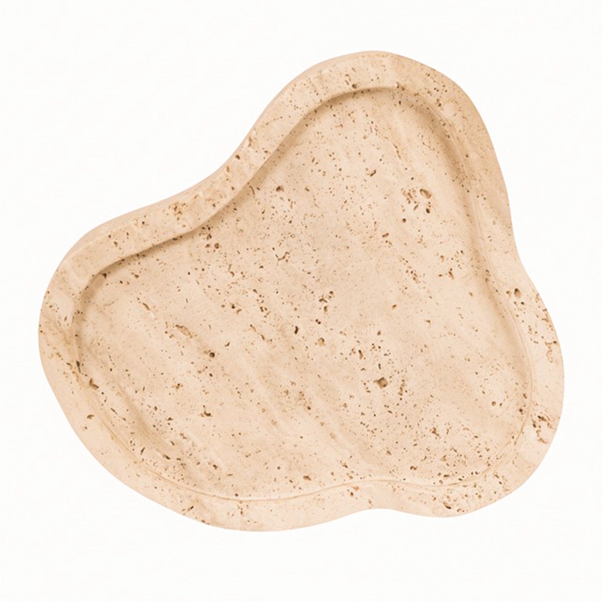 Top view of the Noé Travertine Tray showing its asymmetric irregular silhouette, softly curved raised rim and naturally textured beige stone finish.