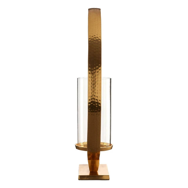 Side view of Octave gold aluminium loop candle holder showing hammered metal frame and glass cylinder on white.