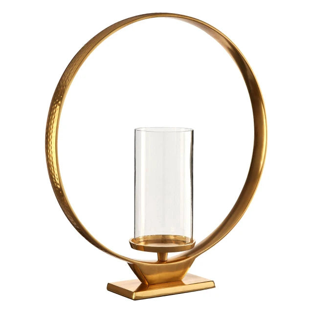 Octave gold aluminium loop candle holder with clear glass cylinder and square base on a plain white background.